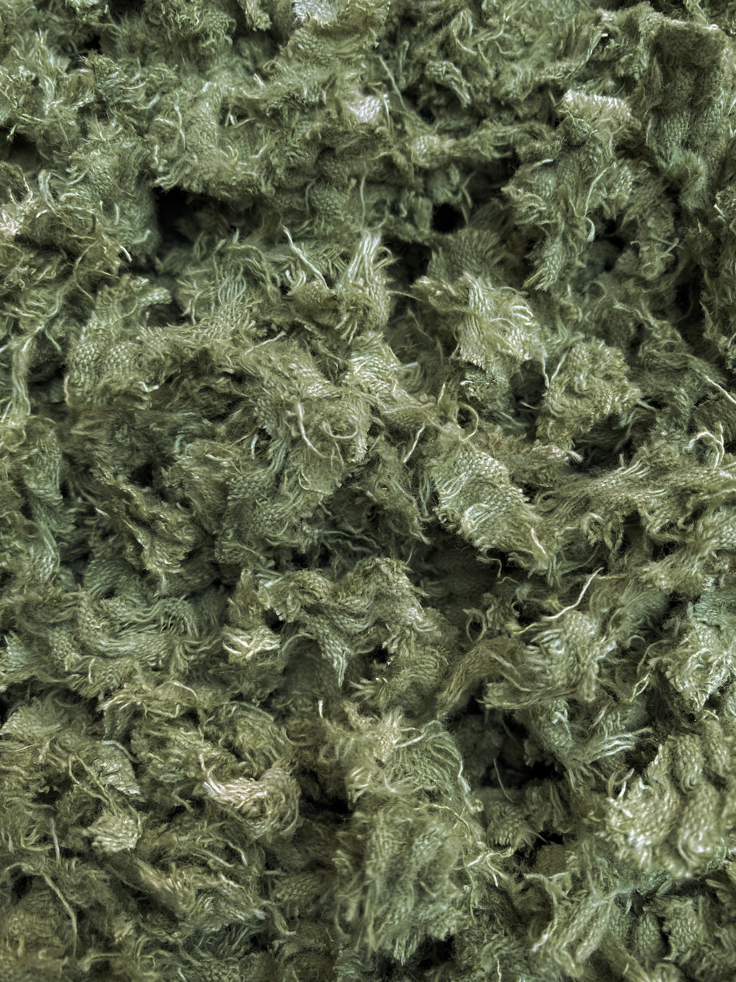 Shredded fibres textile fabric in pistachio green 