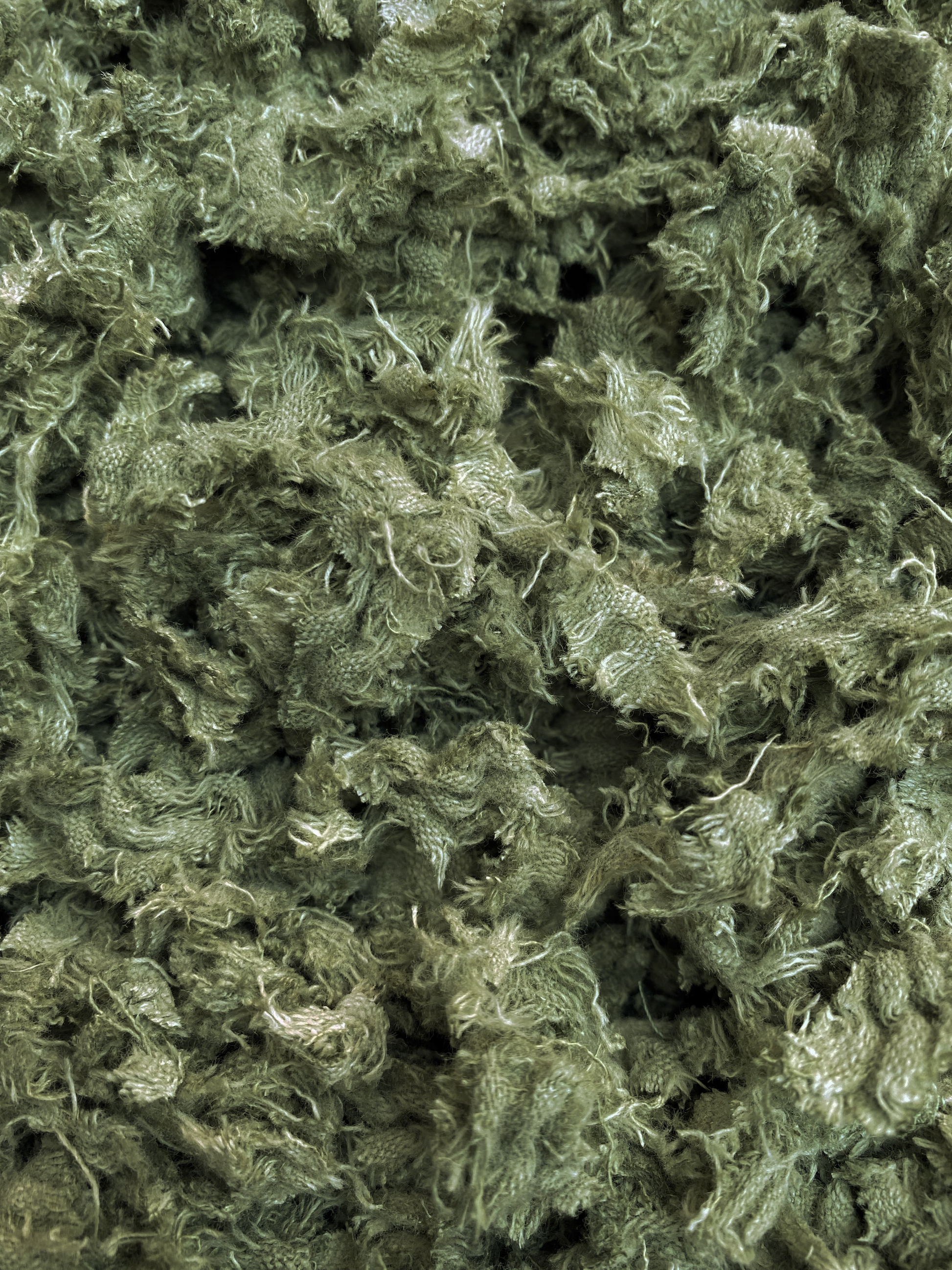 Shredded fibres textile fabric in pistachio green 
