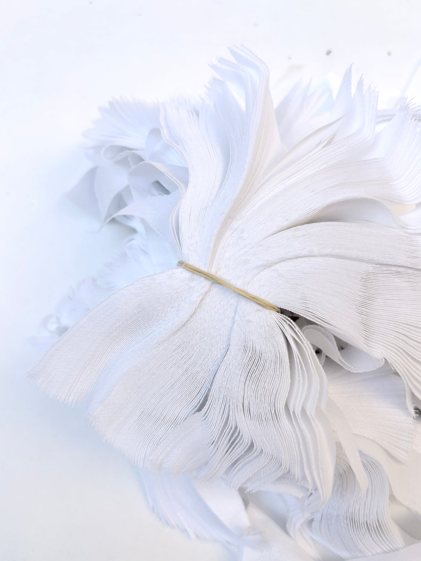 Bundles of fusible woven interfacing offcuts fabric in white 