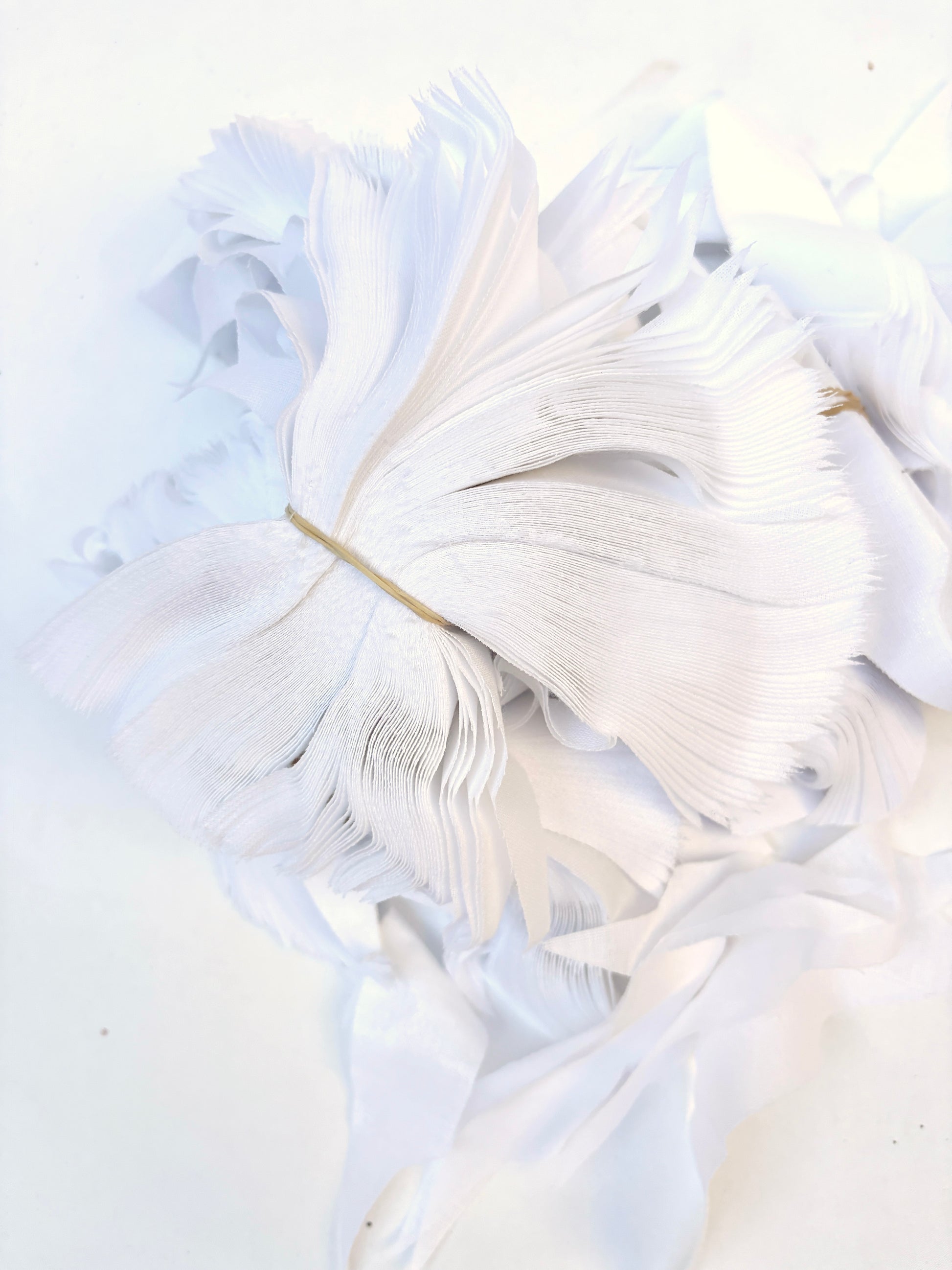 Bundles of fusible woven interfacing offcuts fabric in white 