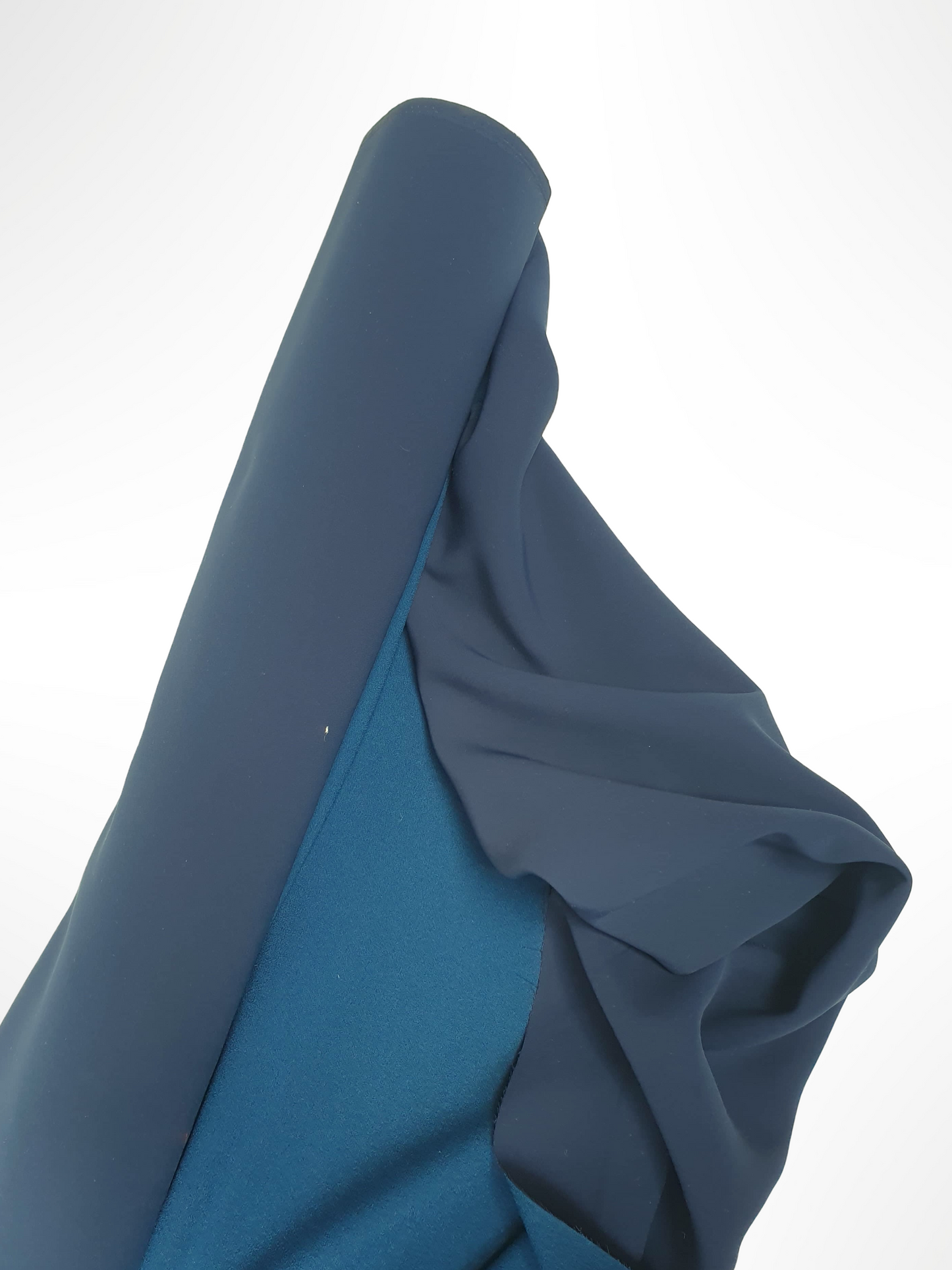 Roll of heavy double-backed fabric in dark teal 
