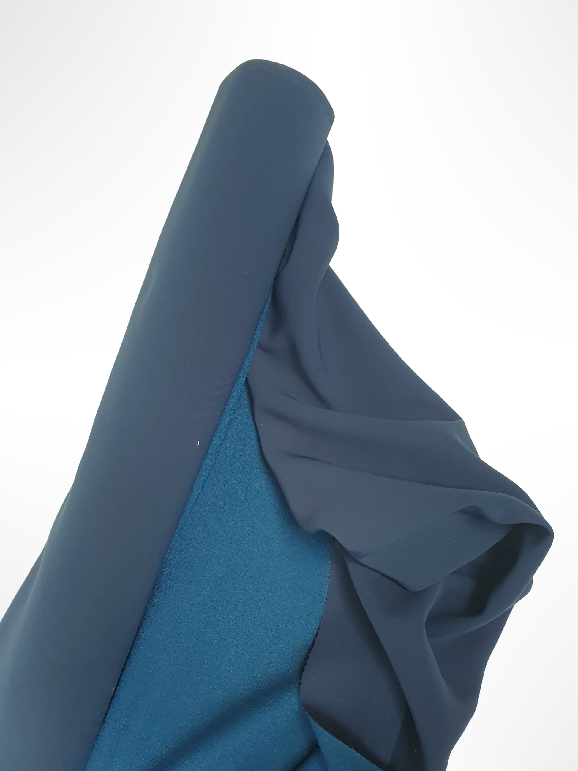 Roll of heavy double-backed fabric in dark teal 