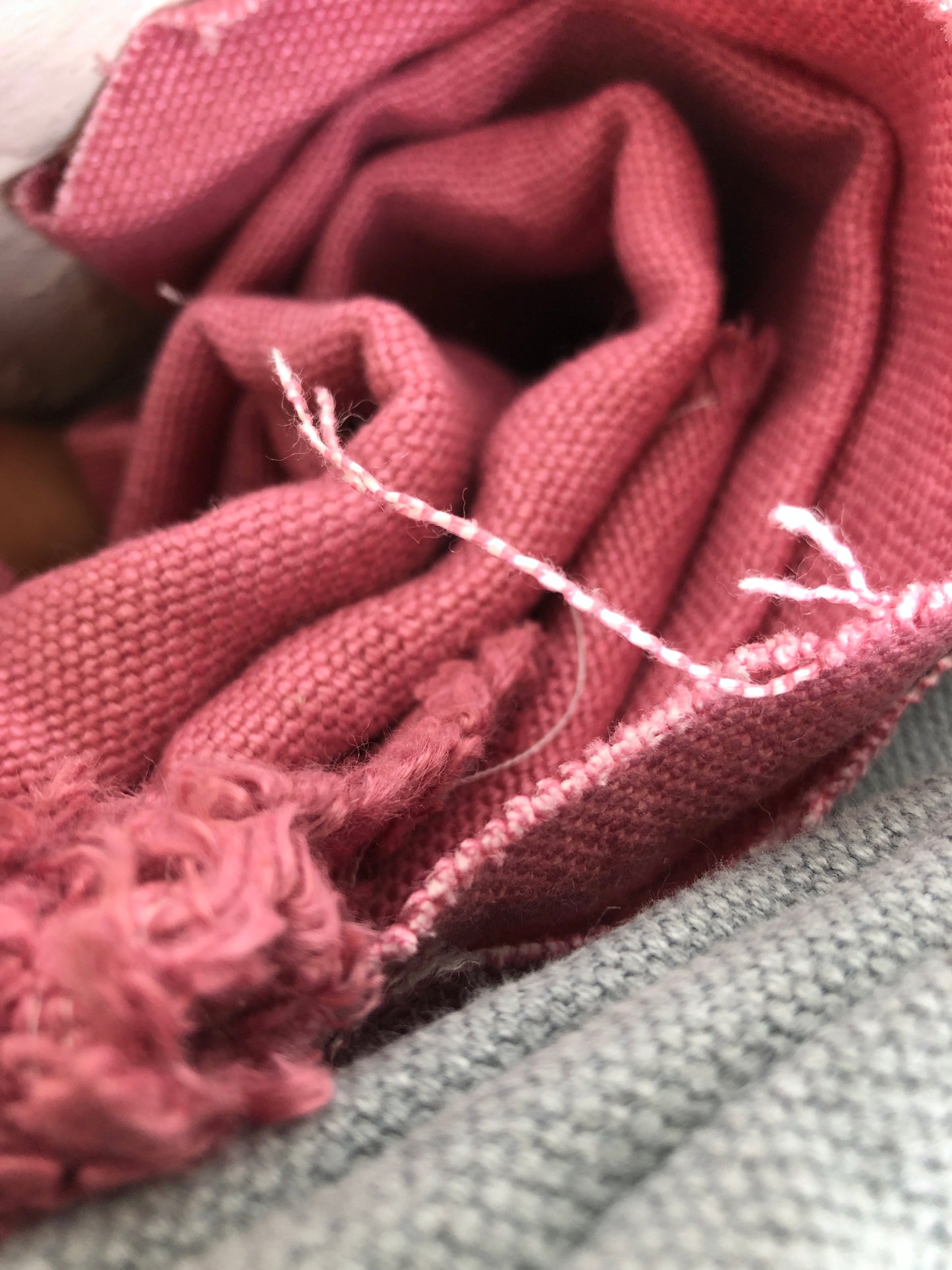 Close-up of heavyweight linen fabric in red and grey