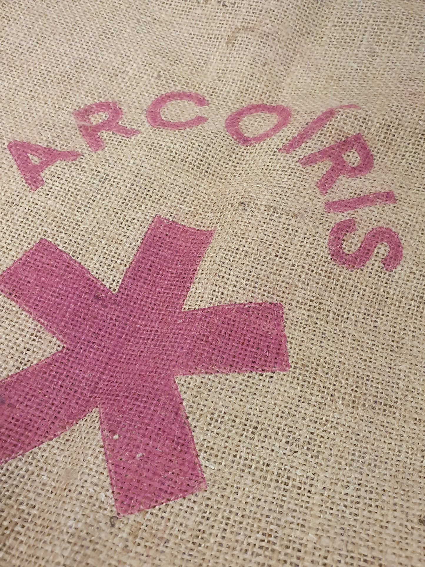 Close-up of hessian fabric coffee jute sack with logo printed on