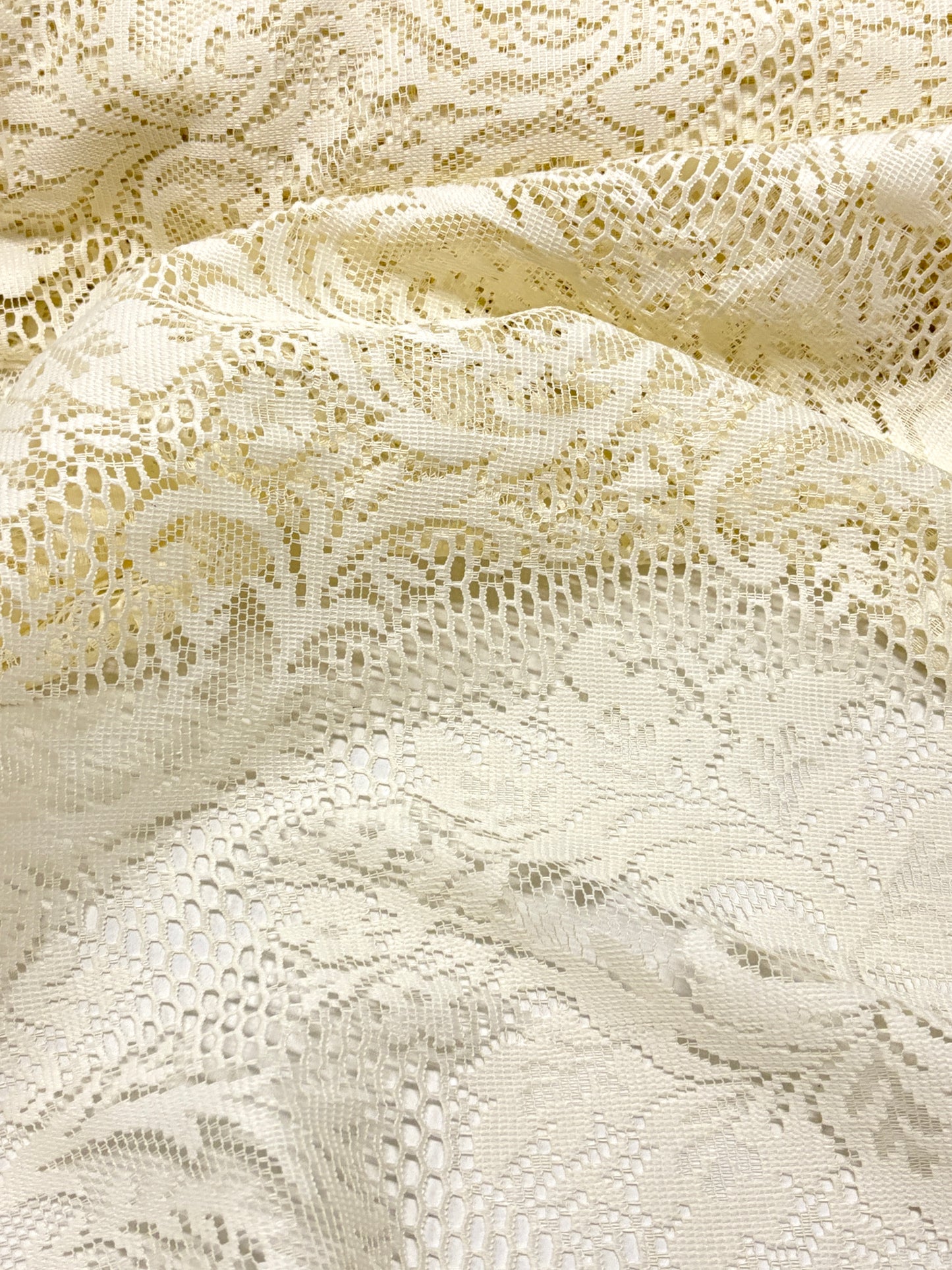 Close-up of lace fabric in cream white 