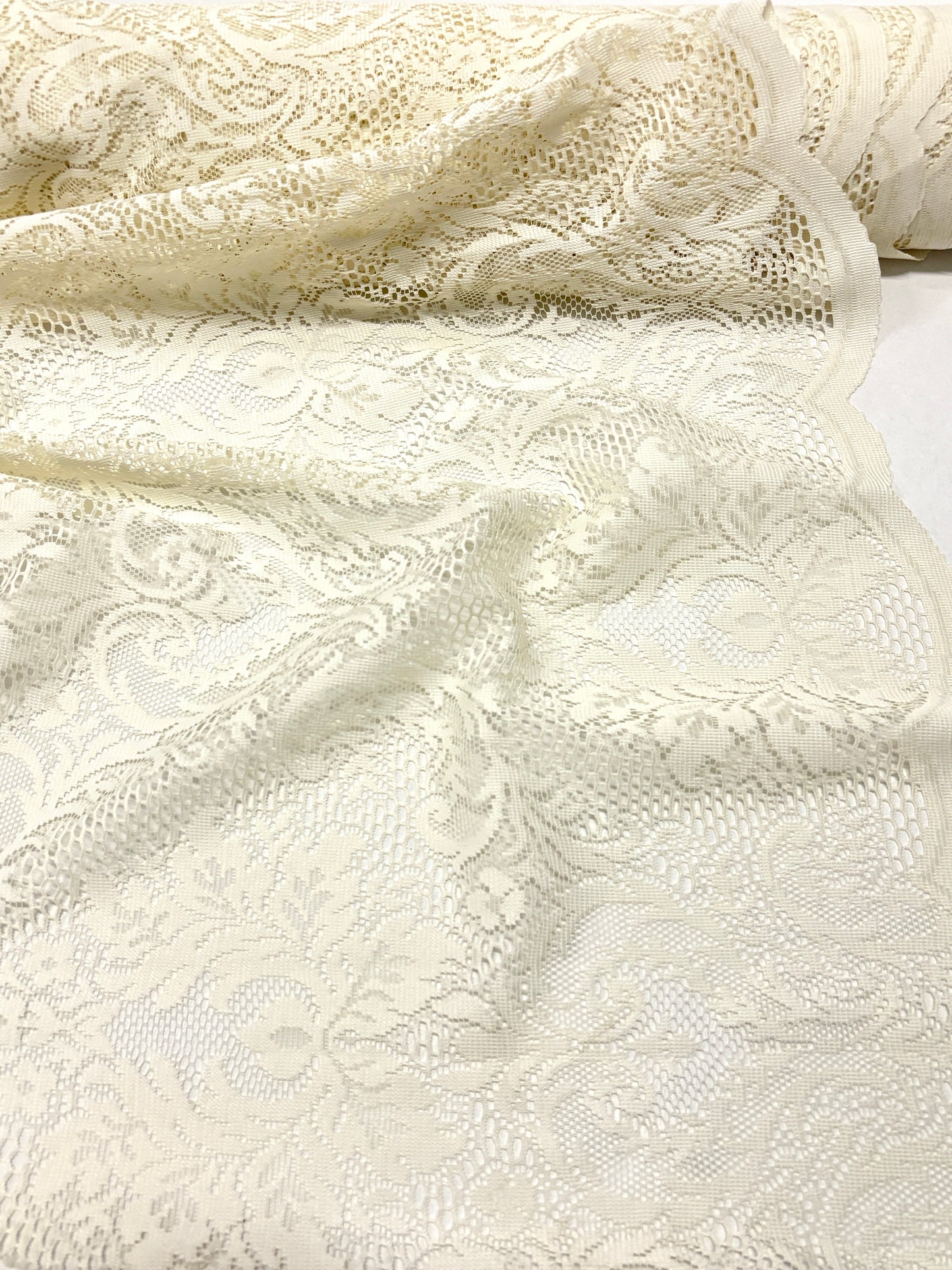 Close-up of lace fabric in cream white 