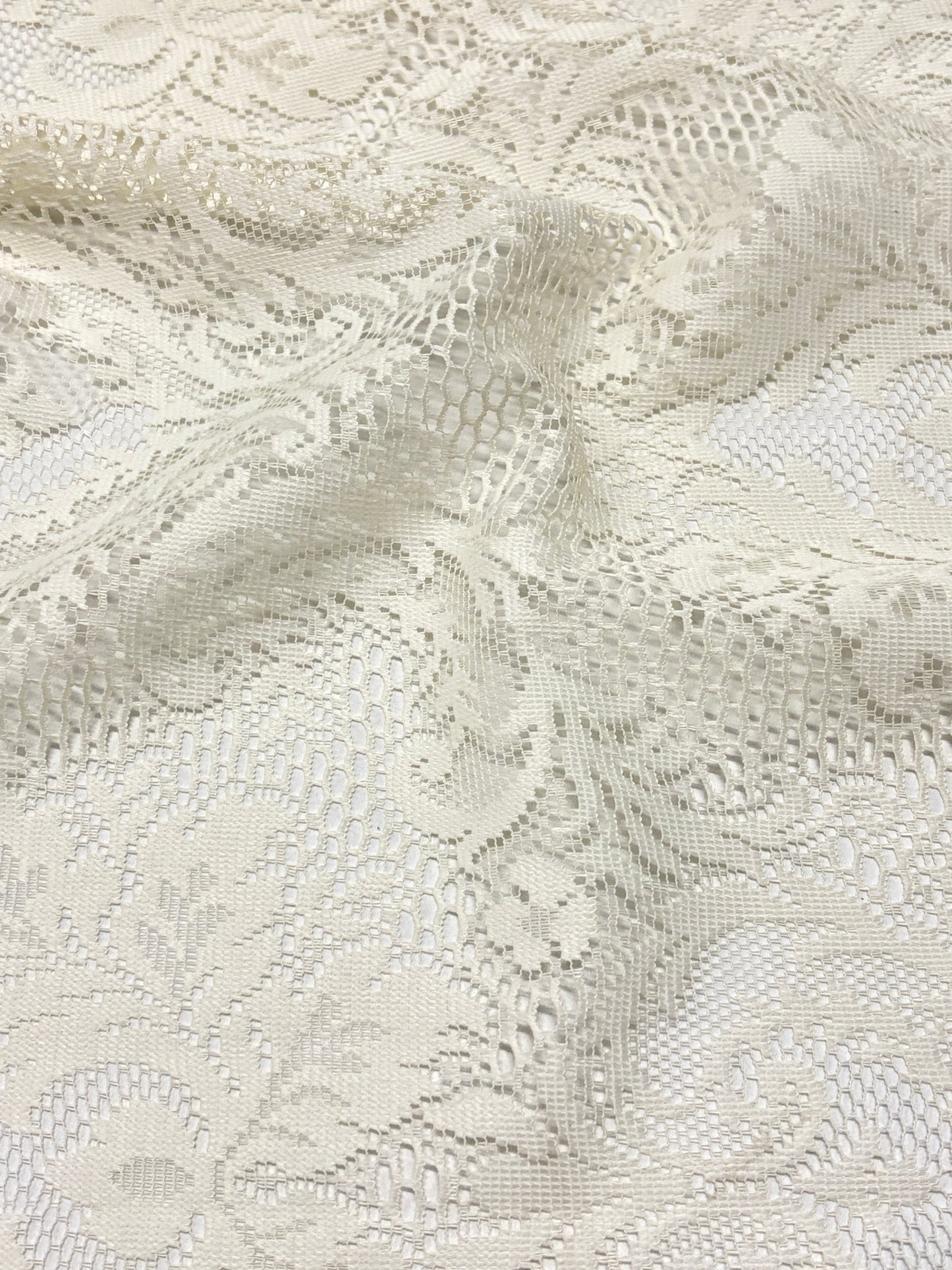 Close-up of lace fabric in cream white 