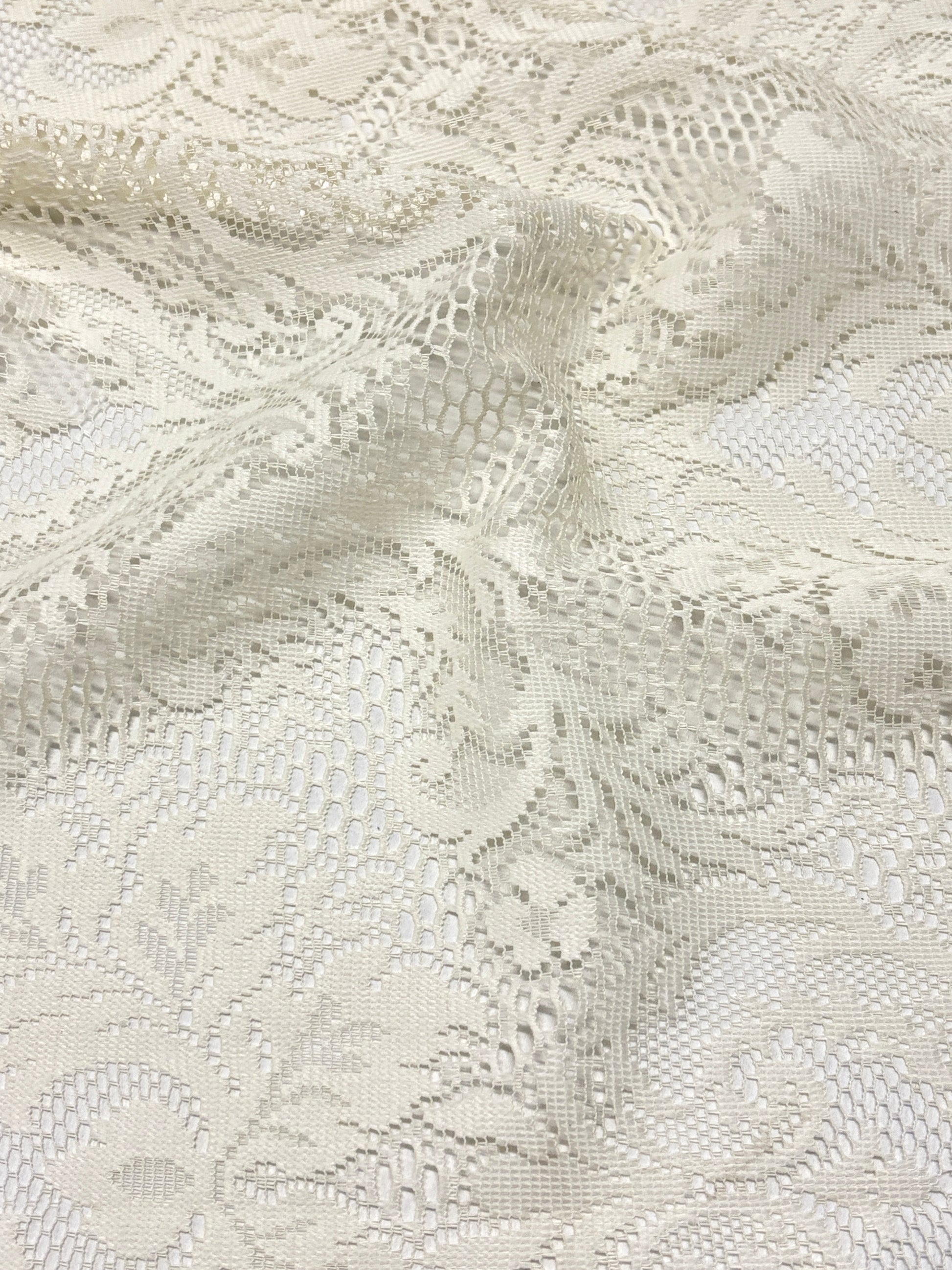 Close-up of lace fabric in cream white 