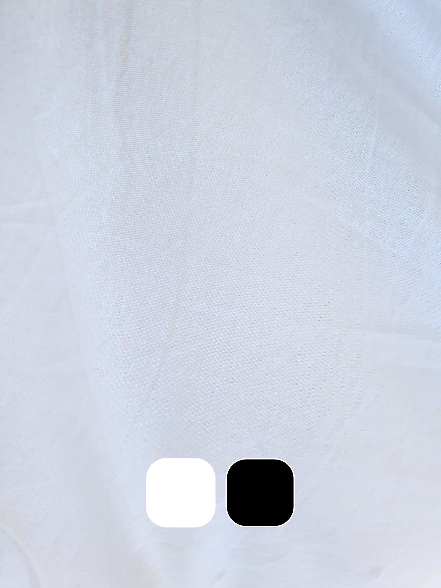 Close-up of wight weighted jersey fabric in white with colour swatches below