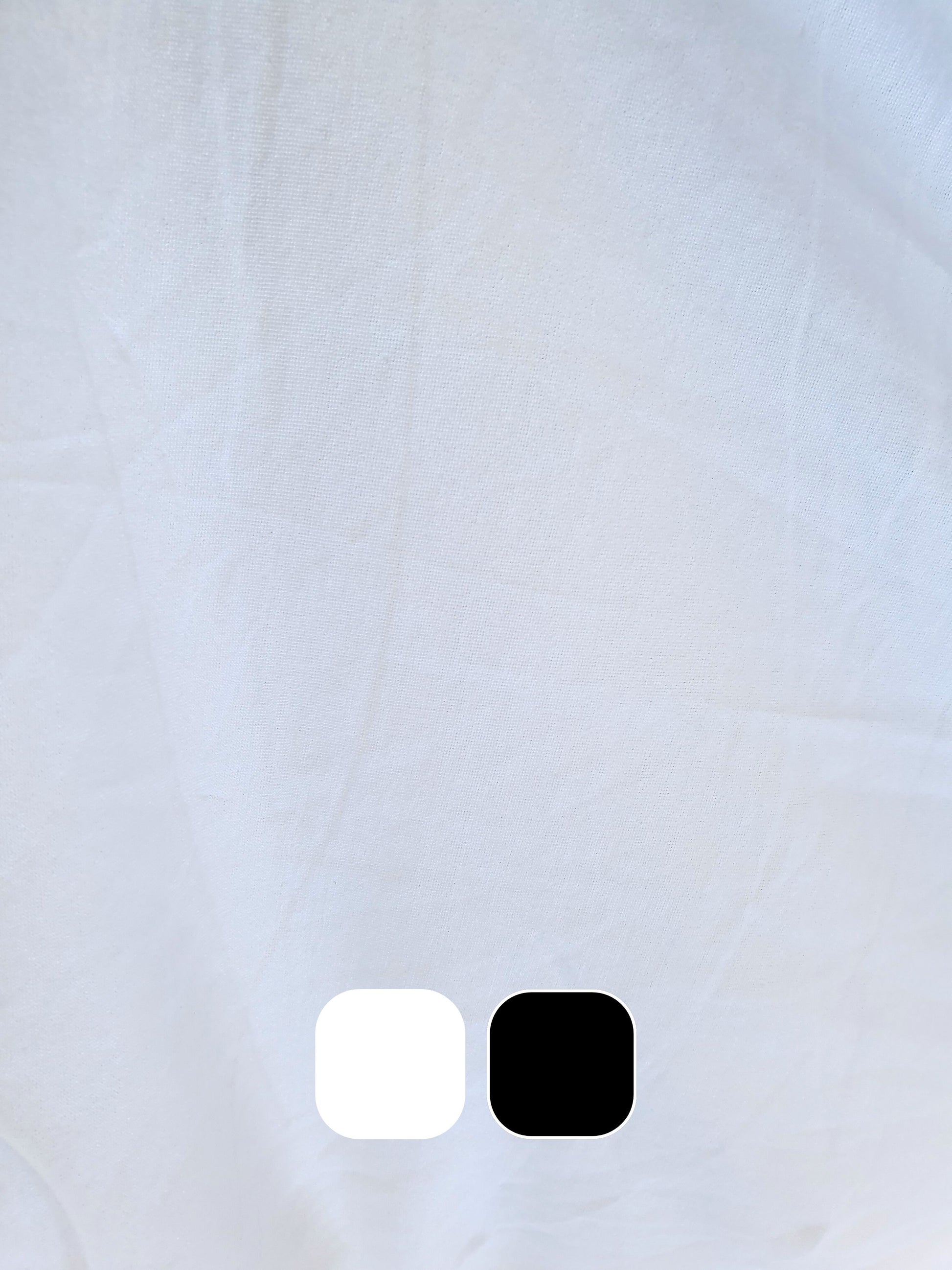 Close-up of wight weighted jersey fabric in white with colour swatches below