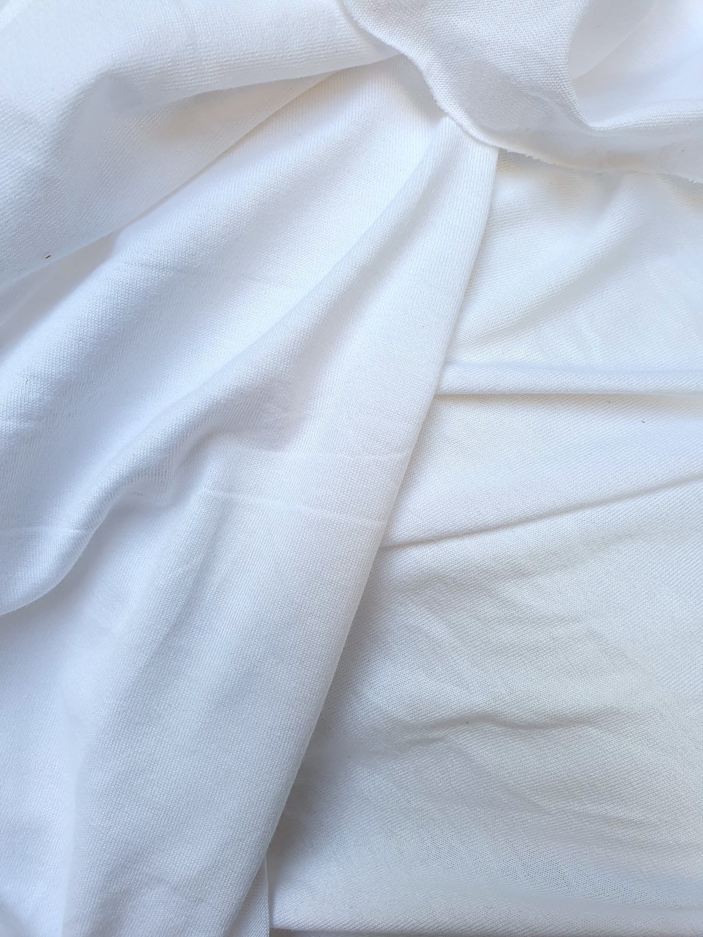 Close-up of wight weighted jersey fabric in white 