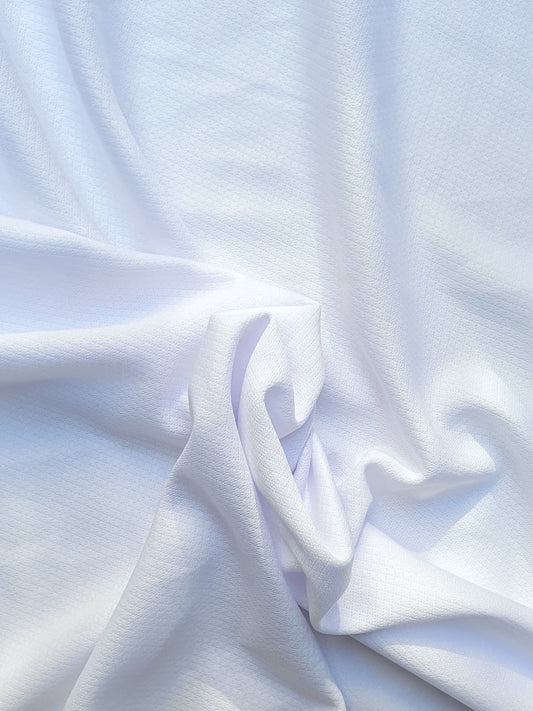 Close-up of jersey light weight fabric in white, soft texture visible 