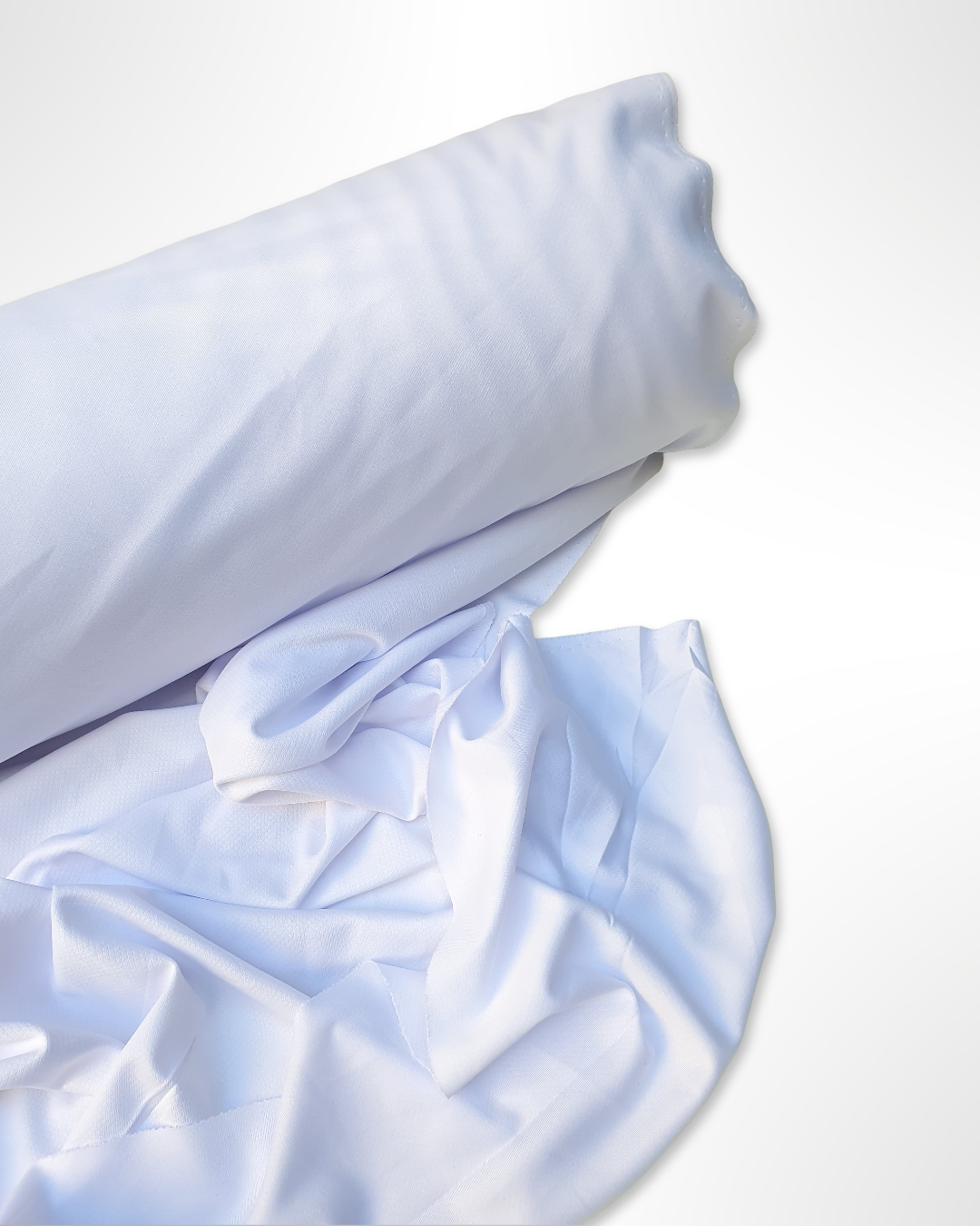 Roll of jersey light weight fabric in white, soft texture visible 