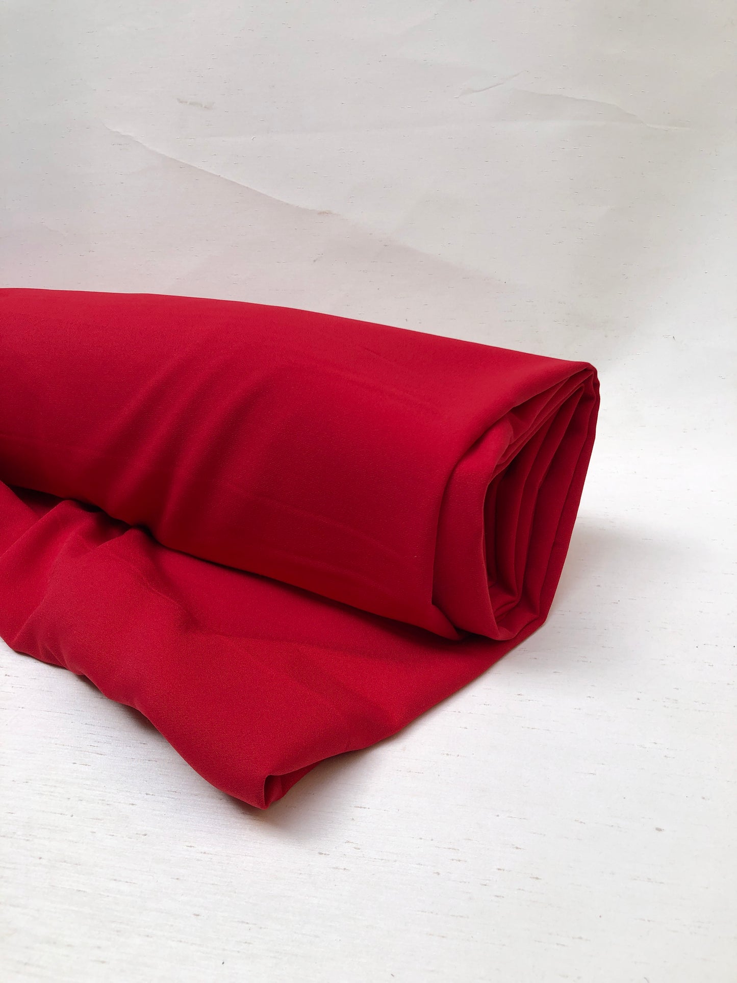 Roll of hopsack fabric in red