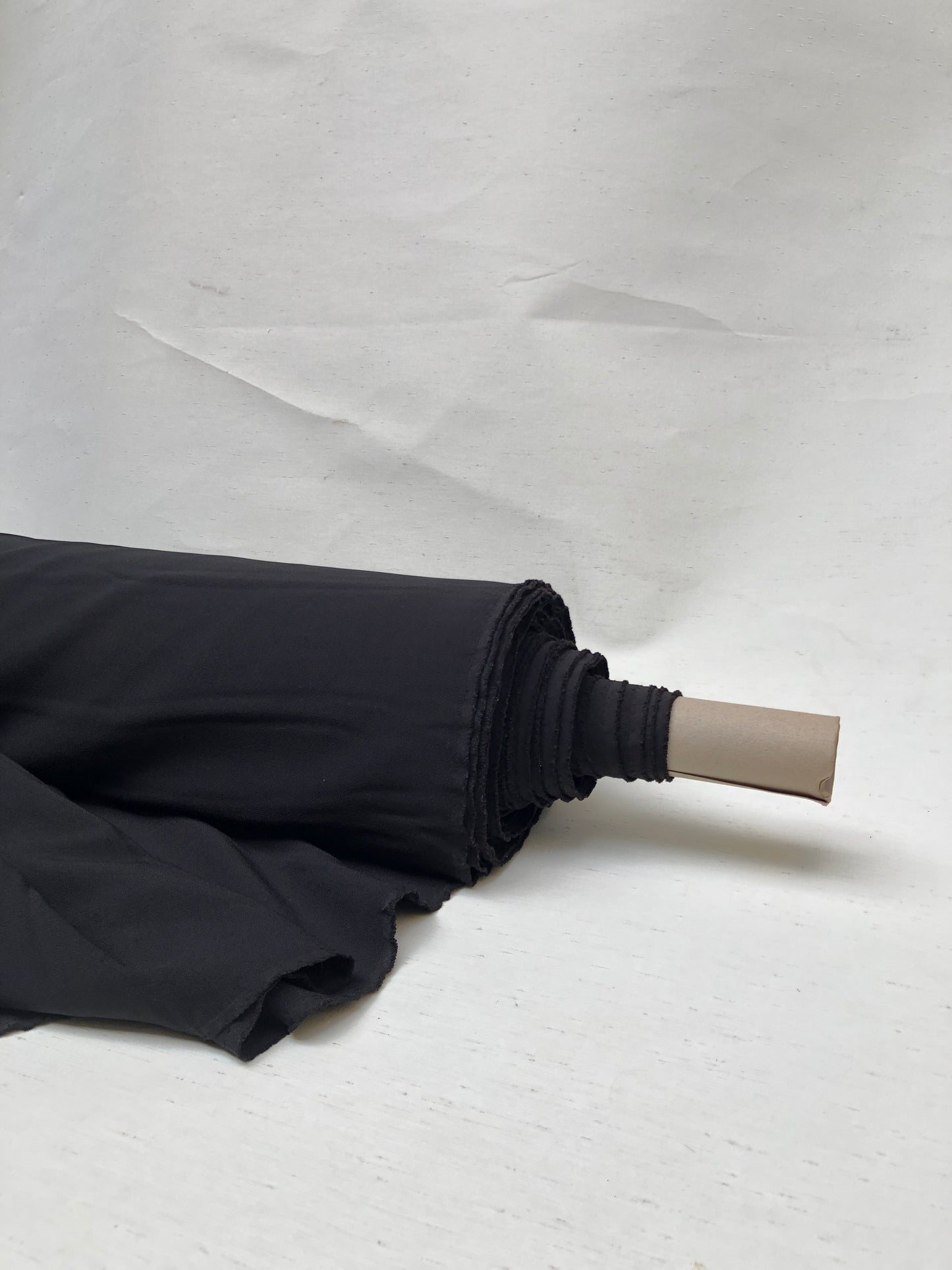 Roll of hopsack fabric in black 