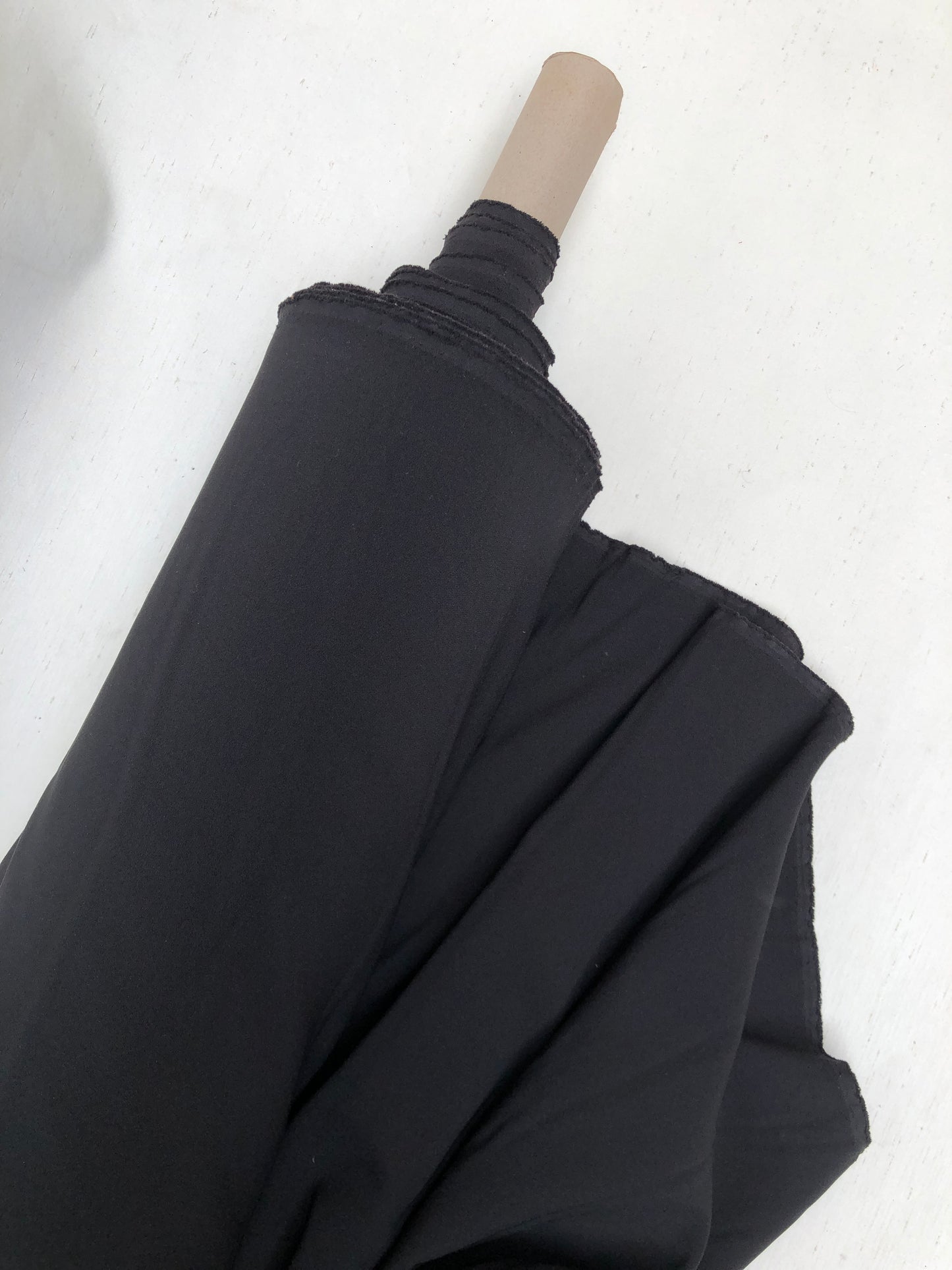 Roll of hopsack fabric in black 