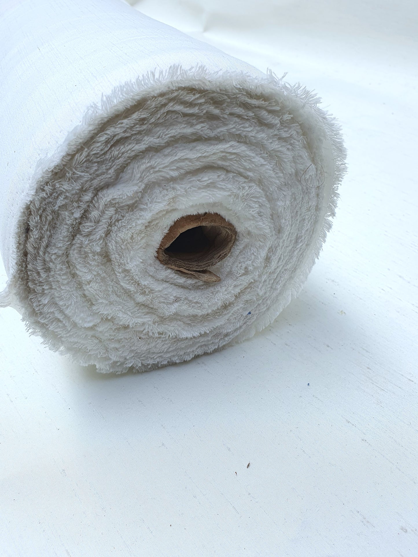 Roll of polyester fabric in Nevada white 