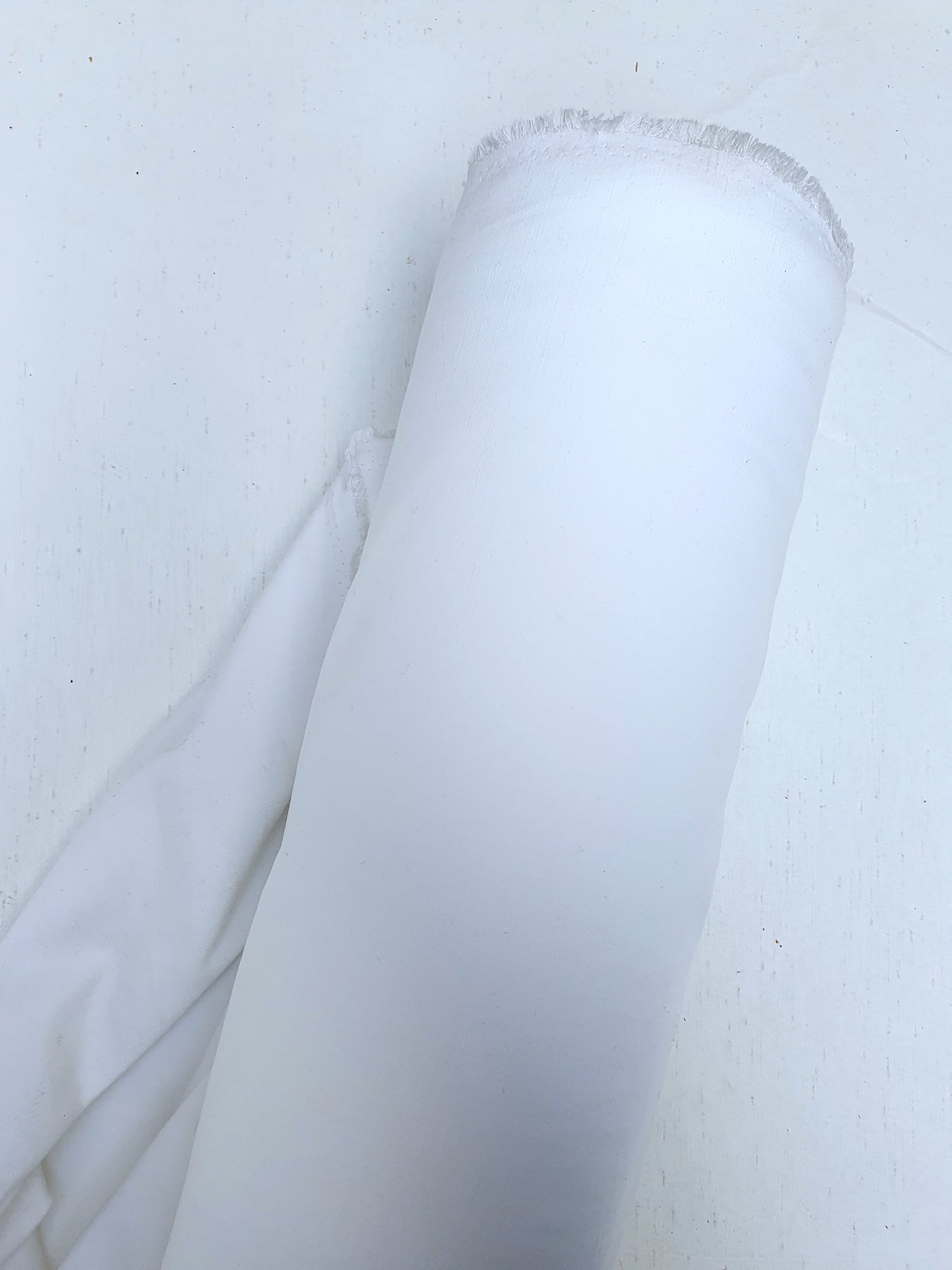 Roll of polyester fabric in Nevada white 