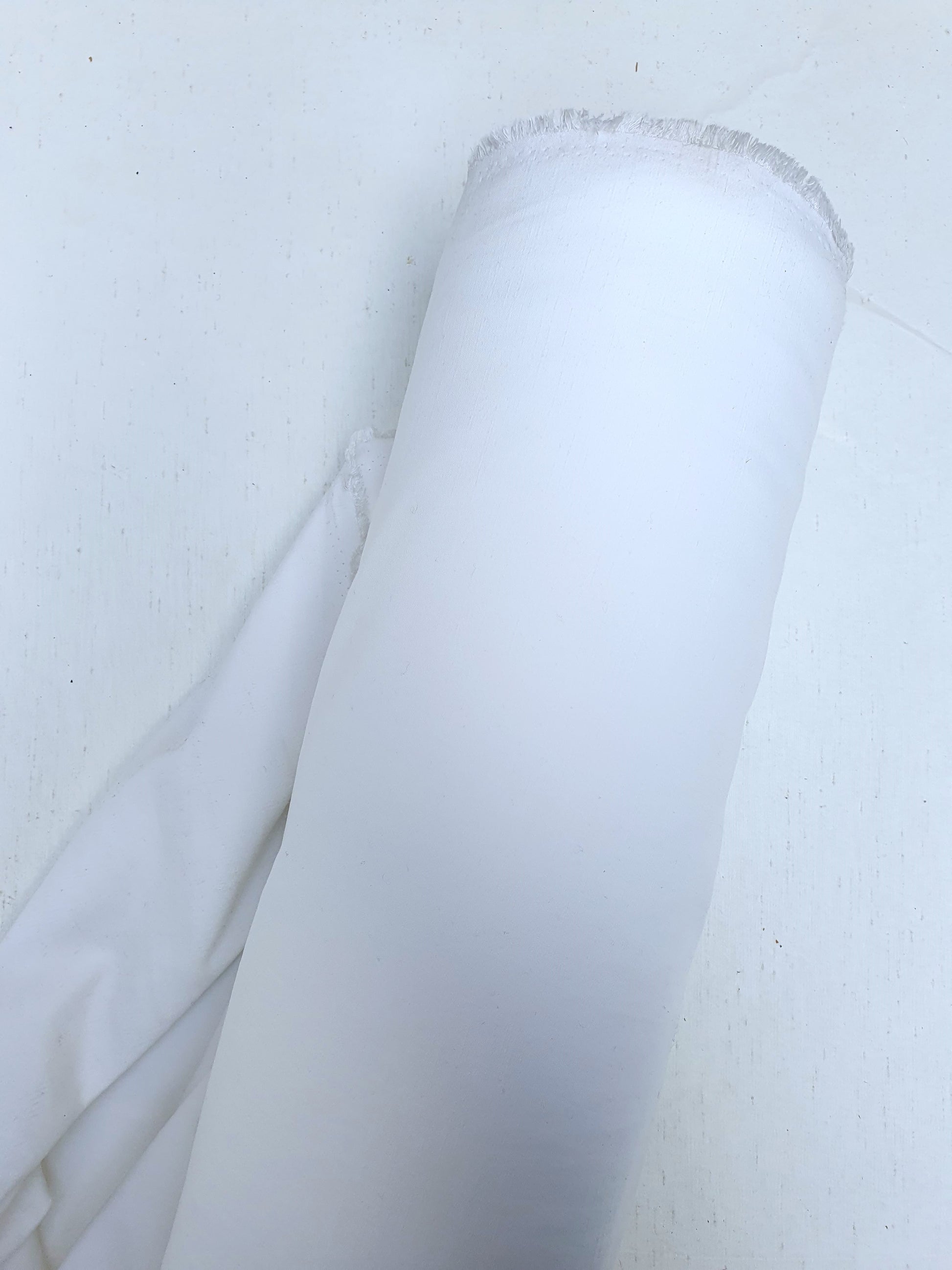 Roll of polyester fabric in Nevada white 