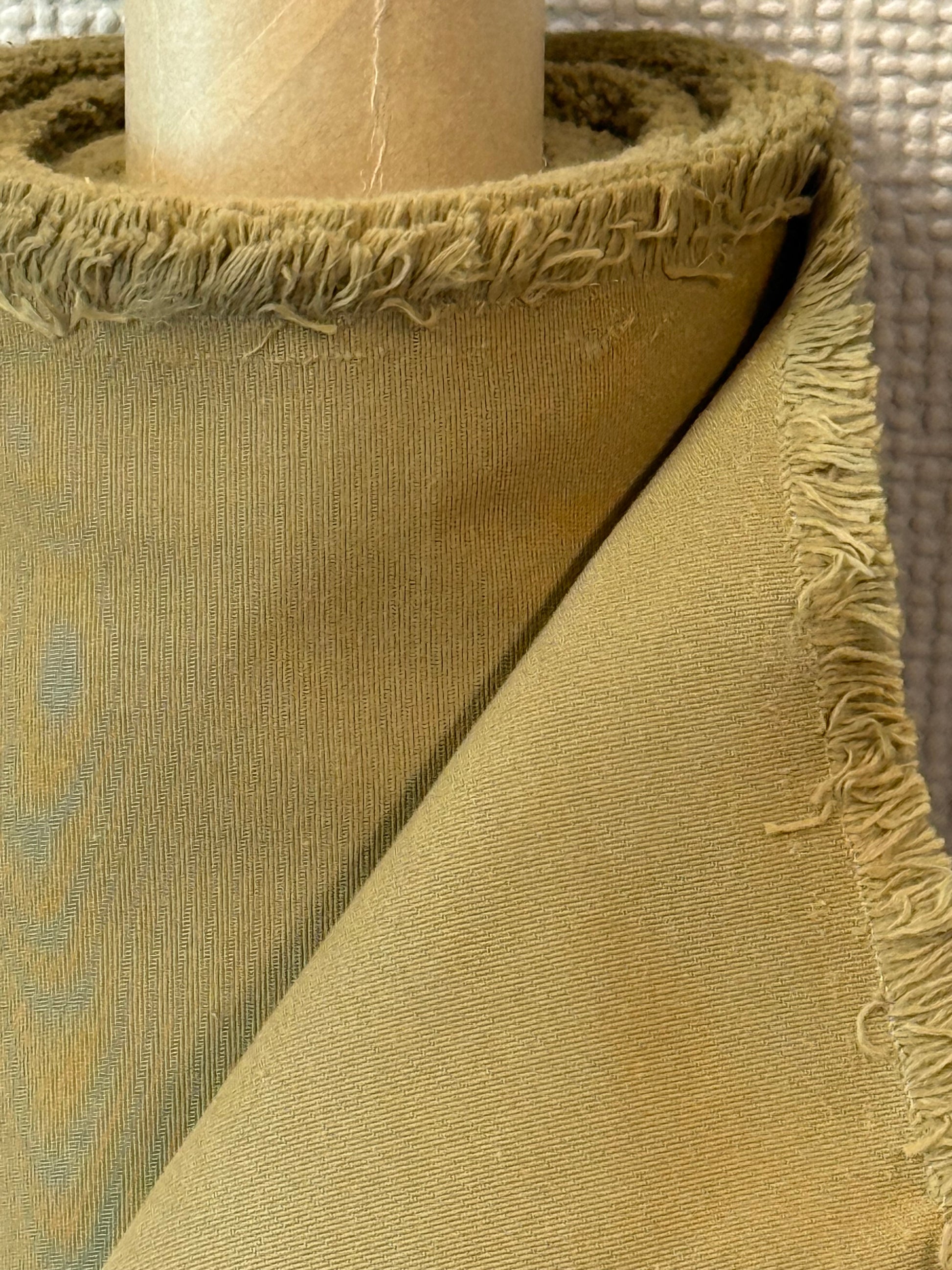 Close-up of organic cotton blended with recycled nylon fabric in beige