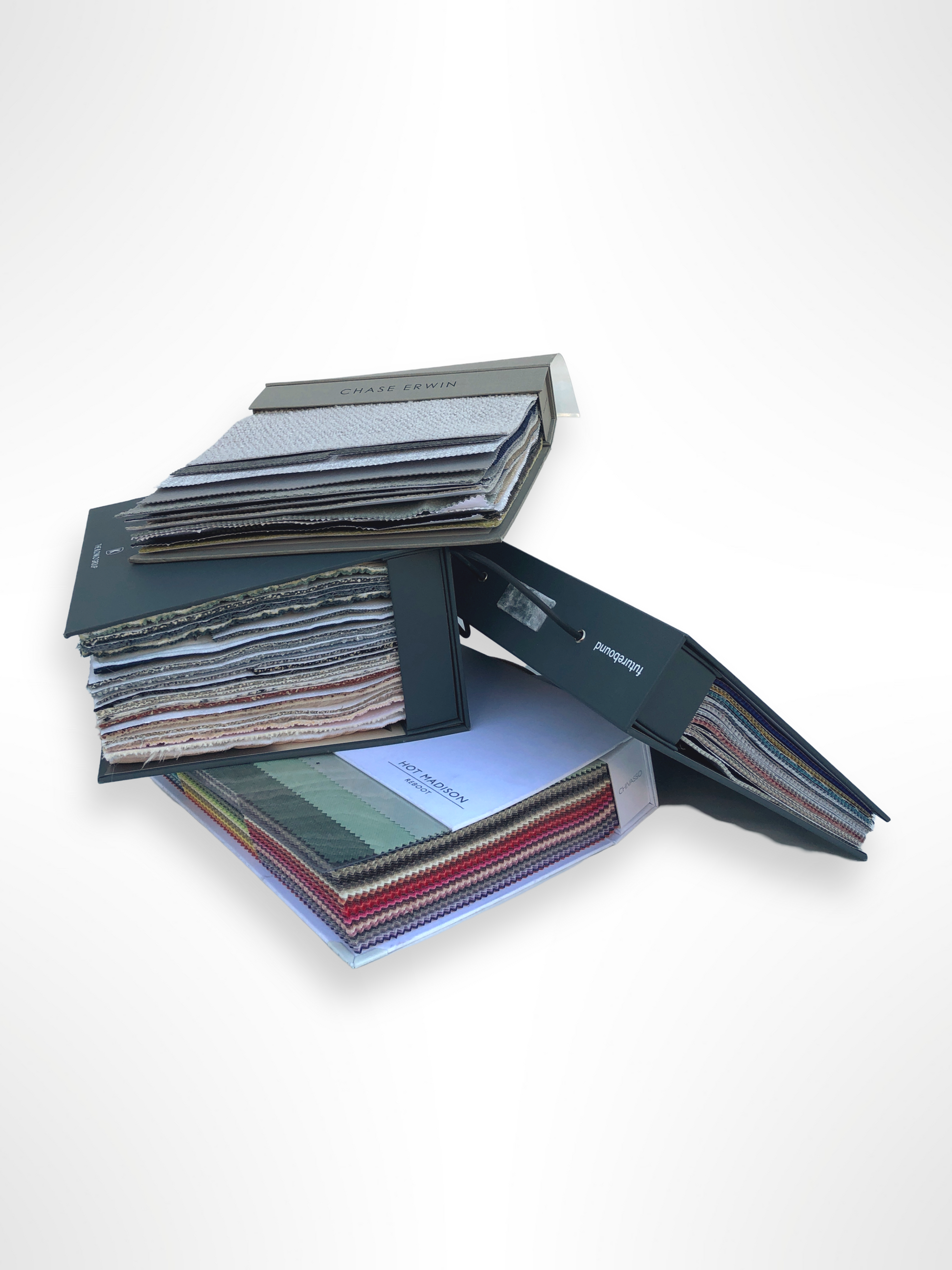 Collection of fabric sample books in various colours 