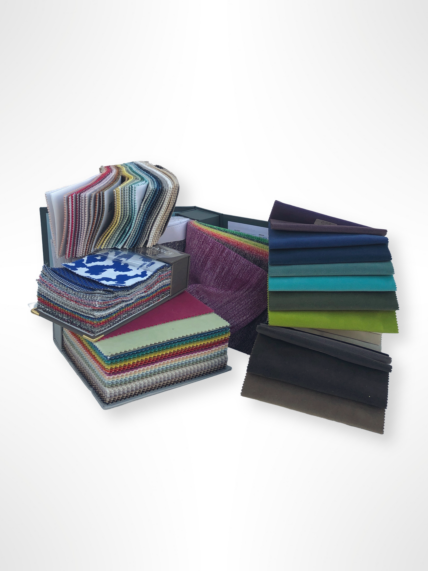 Collection of fabric sample books in various colours 