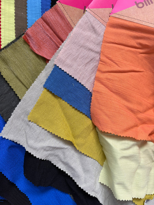 Collection of patterned fabric samples in various colours