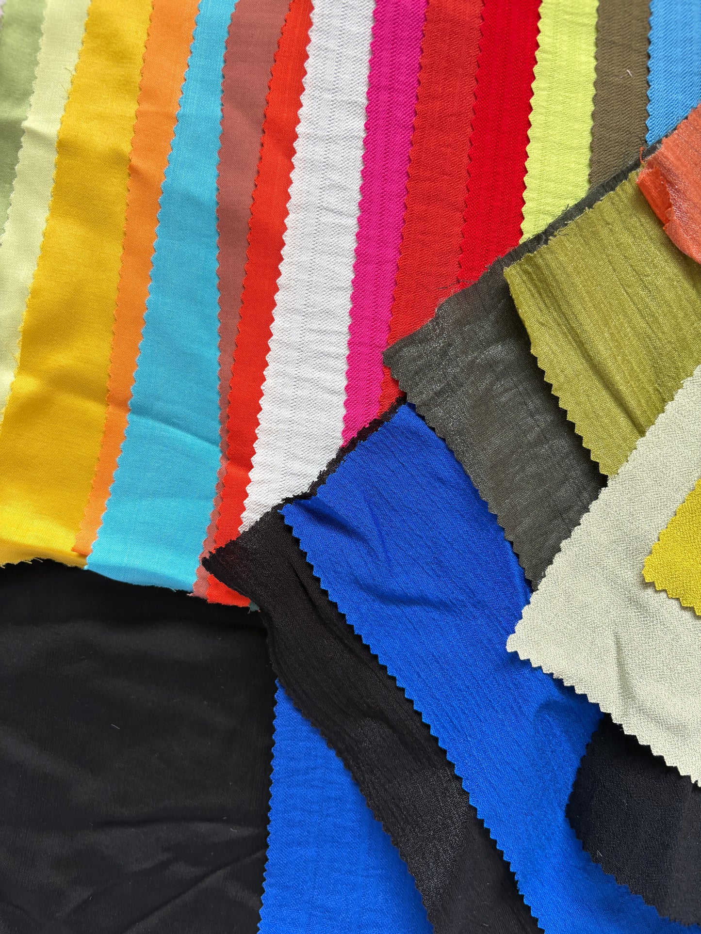 Collection of patterned fabric samples in various colours