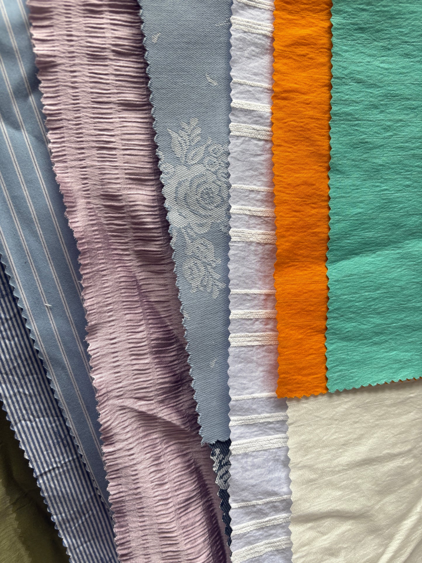 Collection of patterned fabric samples in various colours