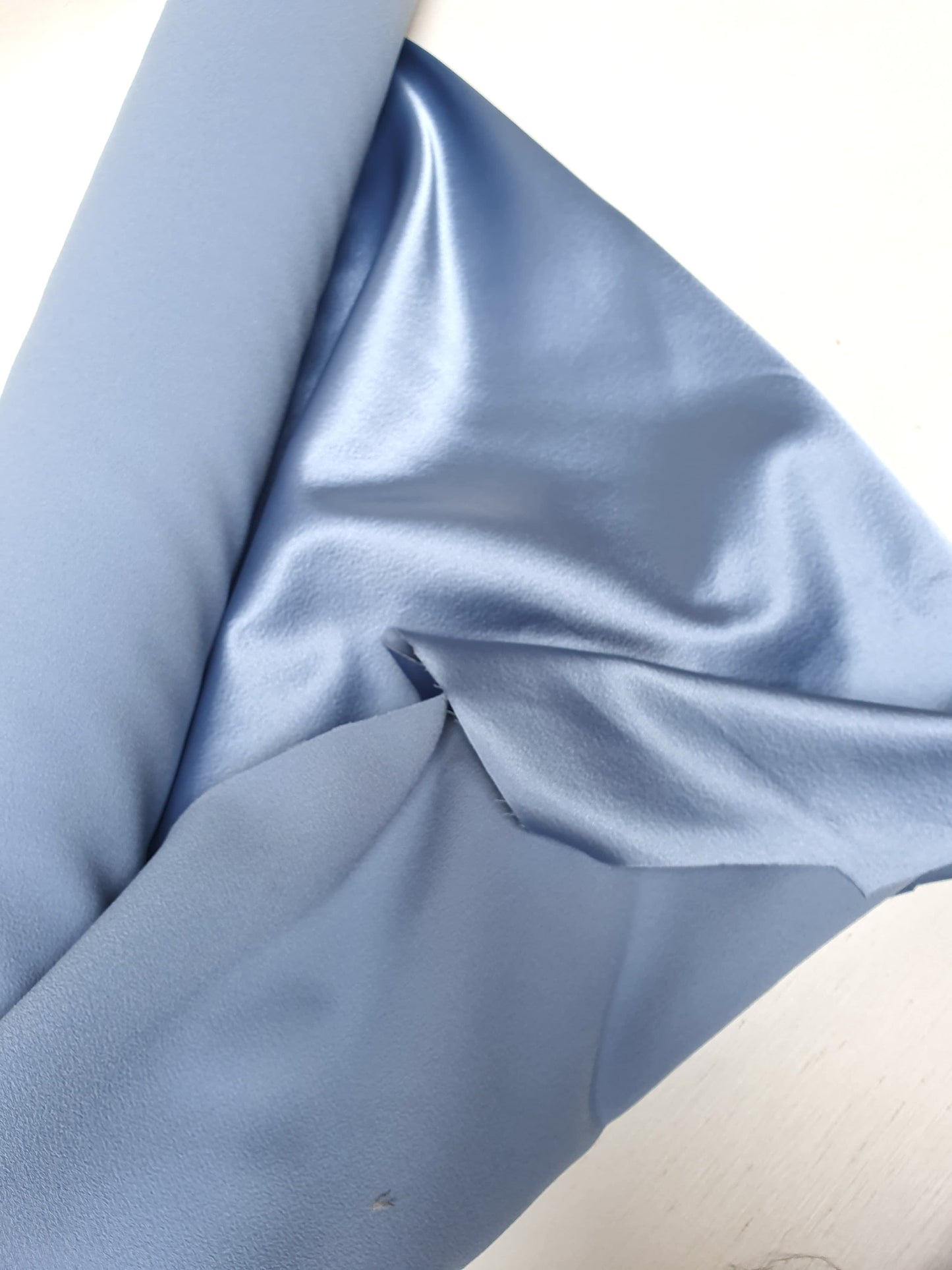 Satin crepe double cloth fabric in baby blue