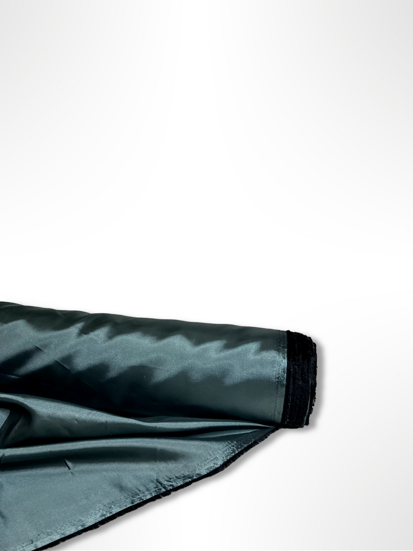 A roll of iridescent turquoise satin fabric with a smooth texture, showing light reflections on its surface.