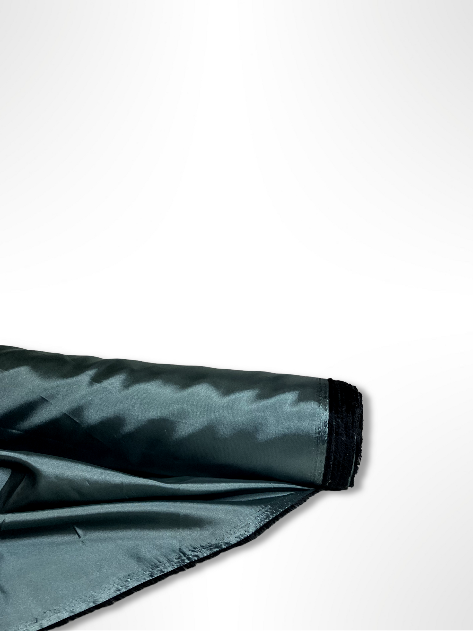 A roll of iridescent turquoise satin fabric with a smooth texture, showing light reflections on its surface.