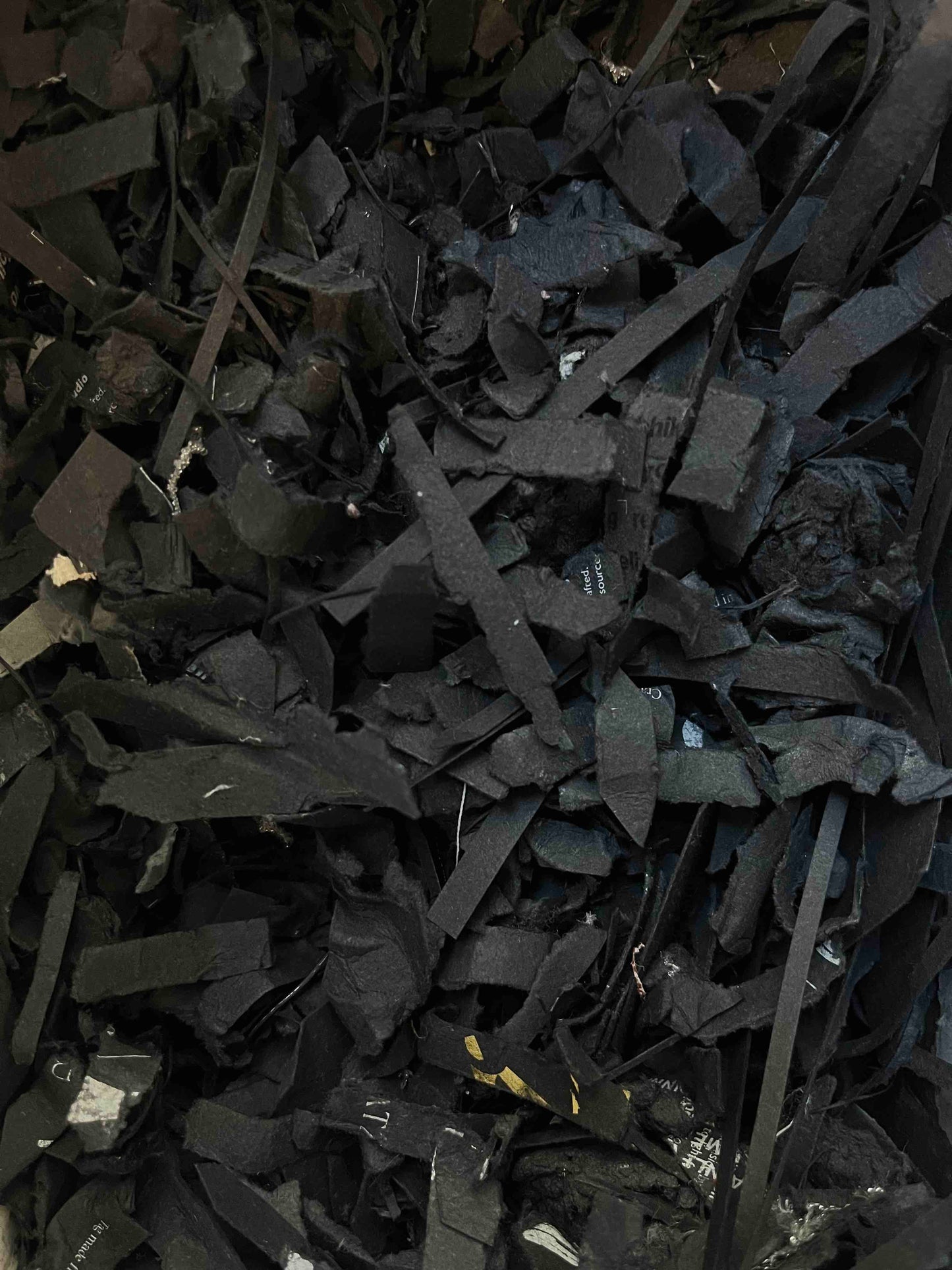 Close-up of shredded papertex offcuts in black 