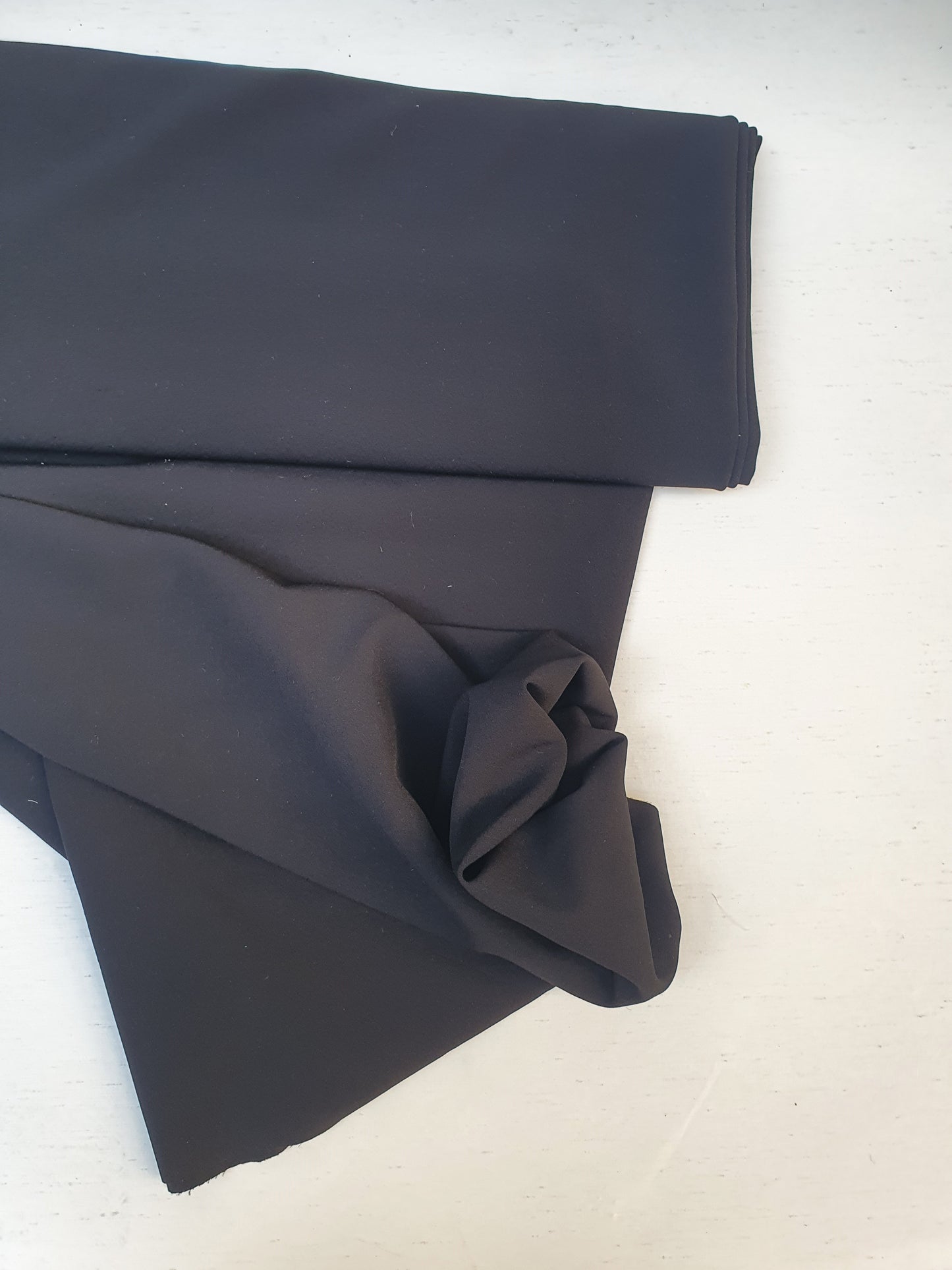 Stretch crepe fabric in black mushroom colour