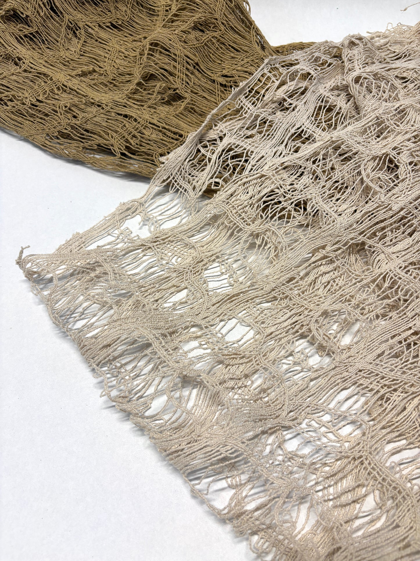 Close-up of jute sheer fabric in beige and brown 
