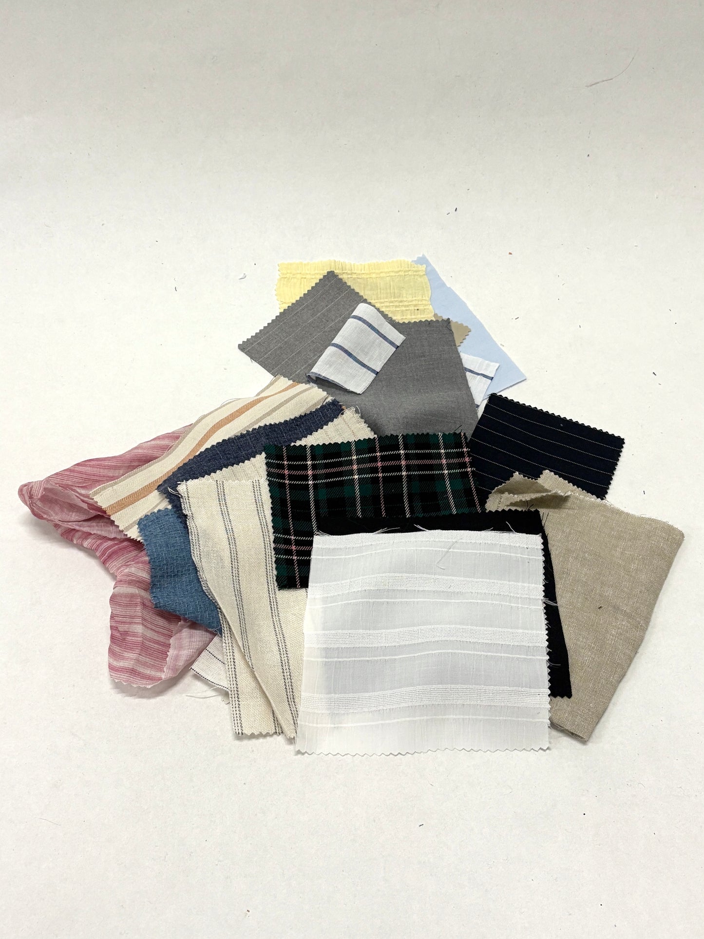 Stack of colourful patterned light-weighted fabric swatches