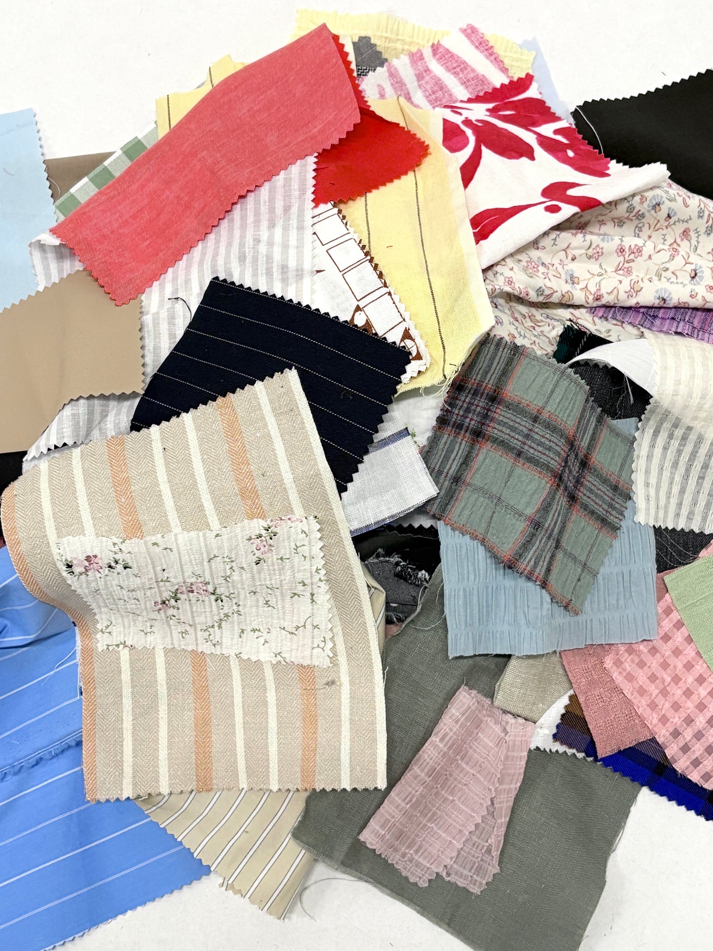 Stack of colourful patterned light-weighted fabric swatches