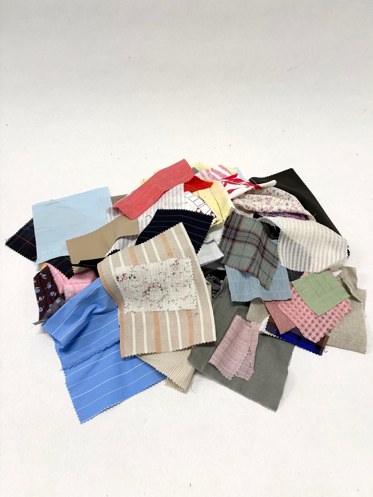 Stack of colourful patterned light-weighted fabric swatches