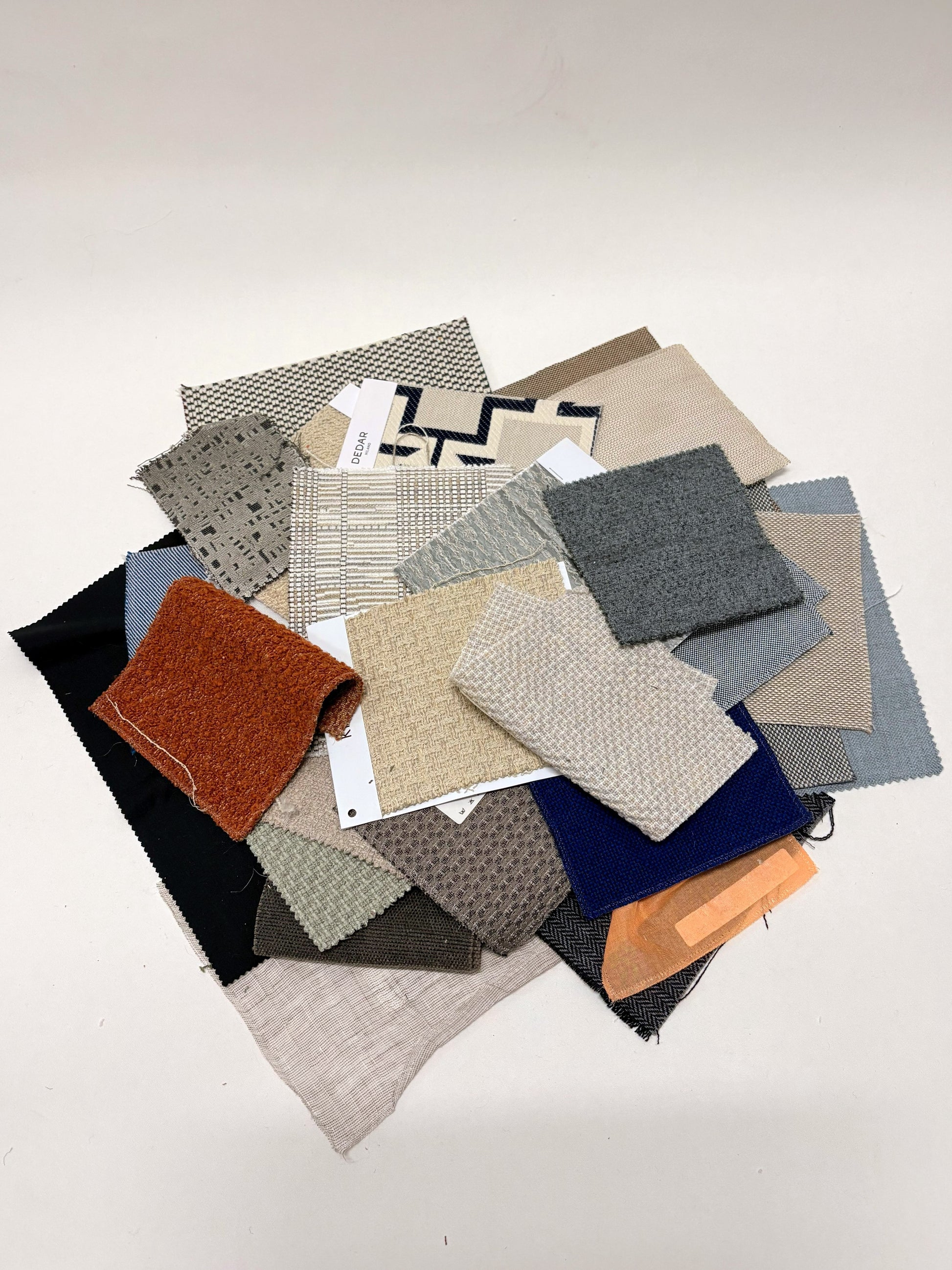 Collection of fabric swatches with various patterns and colours