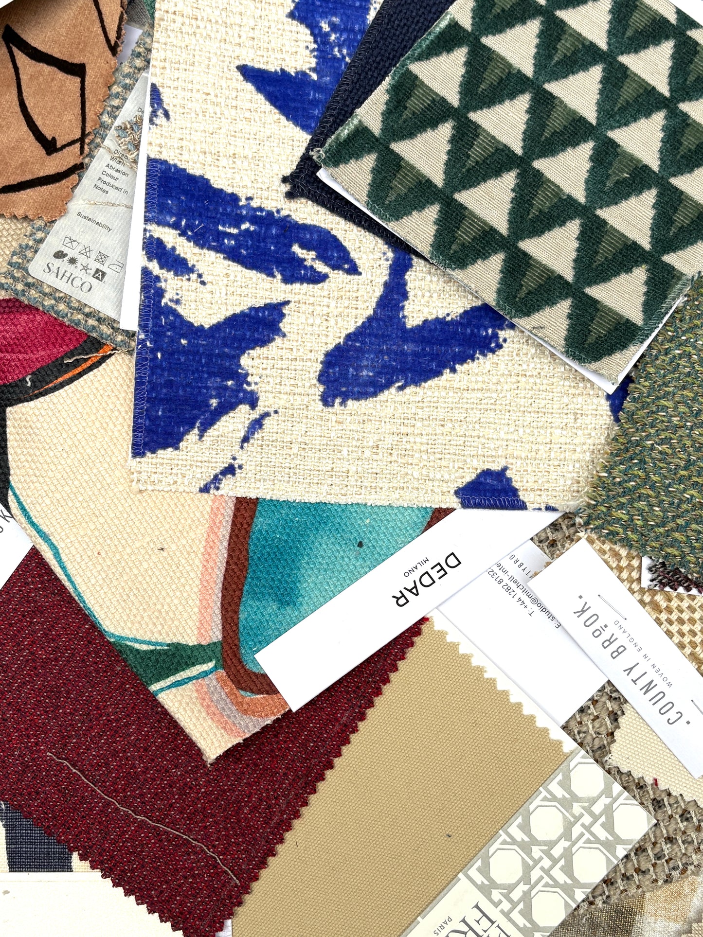 Collection of fabric swatches with various patterns and colours
