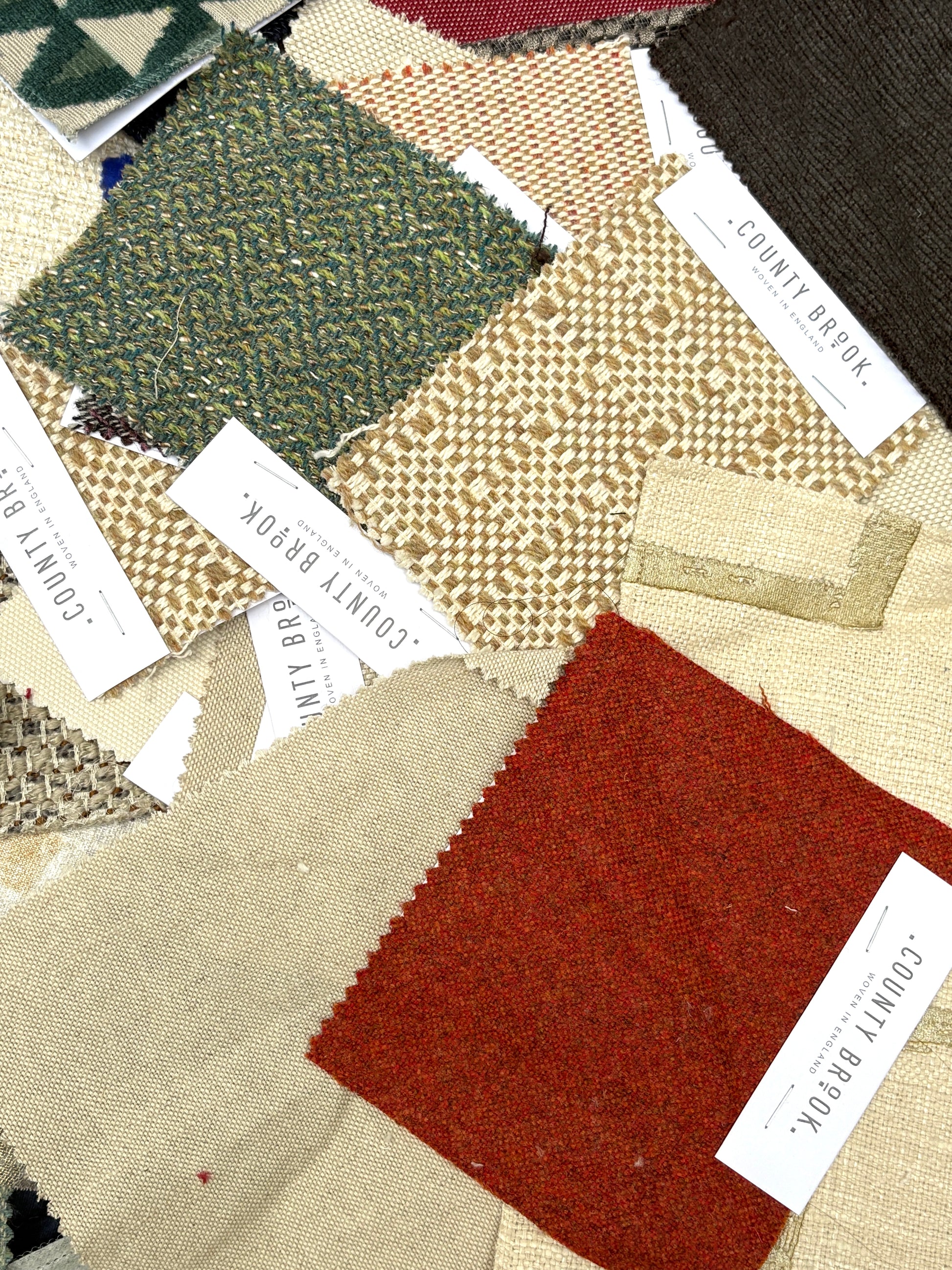 Collection of fabric swatches with various textures and colours 