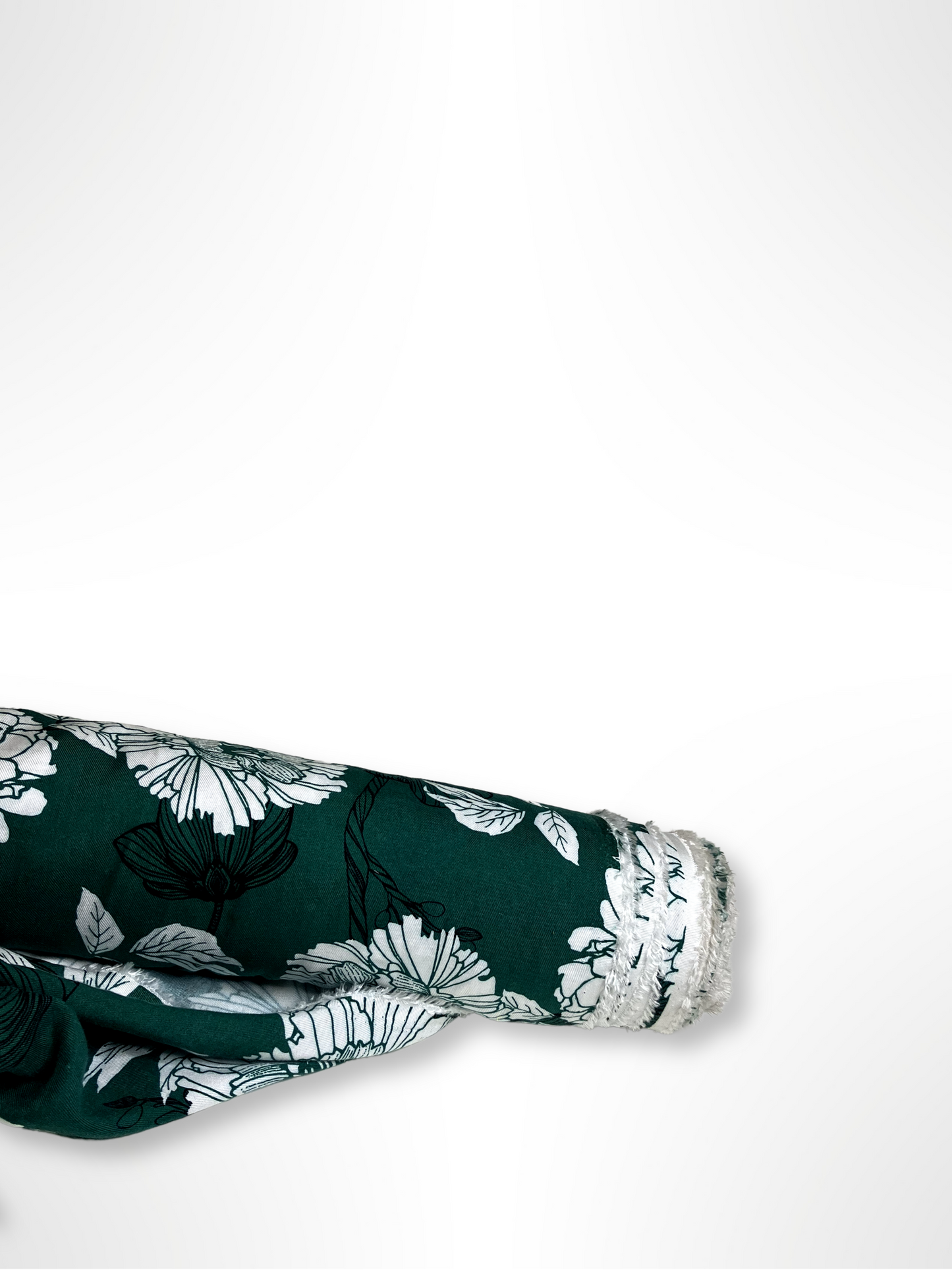 A green twill rolled fabric with a floral print 