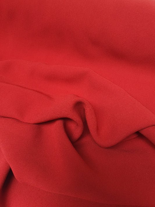 Close-up of red twill rolled fabric  