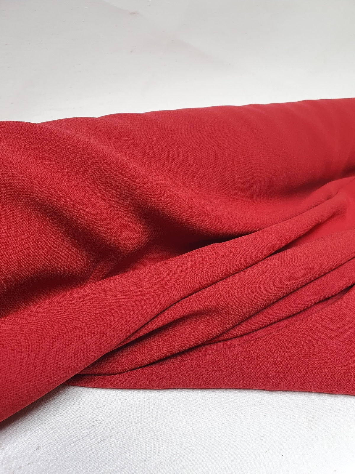 Red twill rolled fabric with soft texture