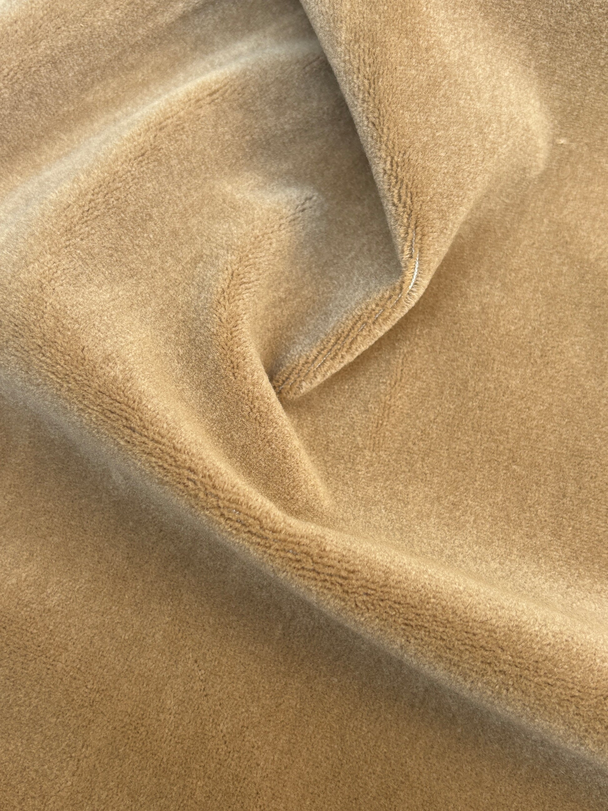 Dark camel velvet fabric roll with soft texture 