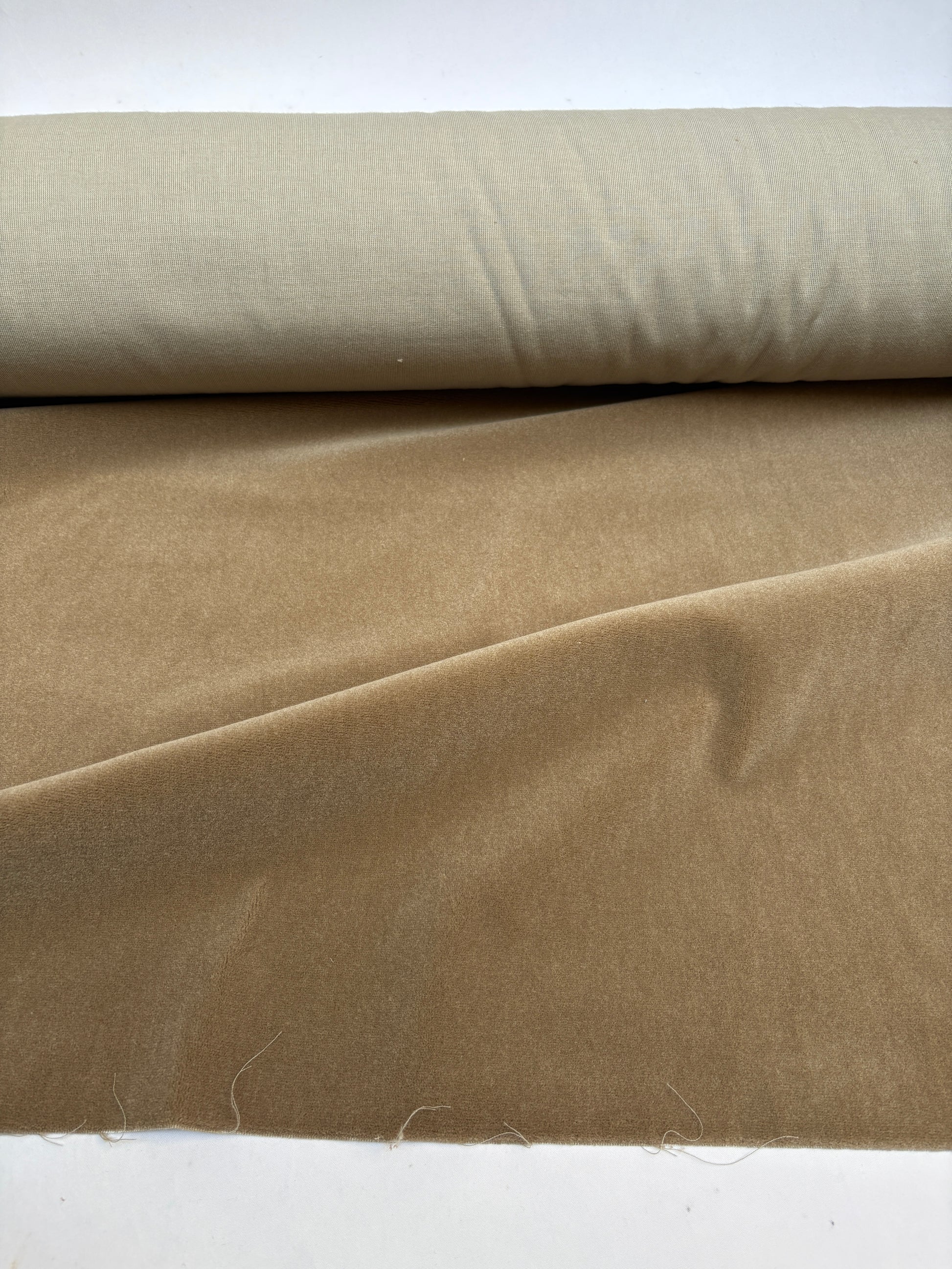 Dark camel velvet fabric roll with soft texture 