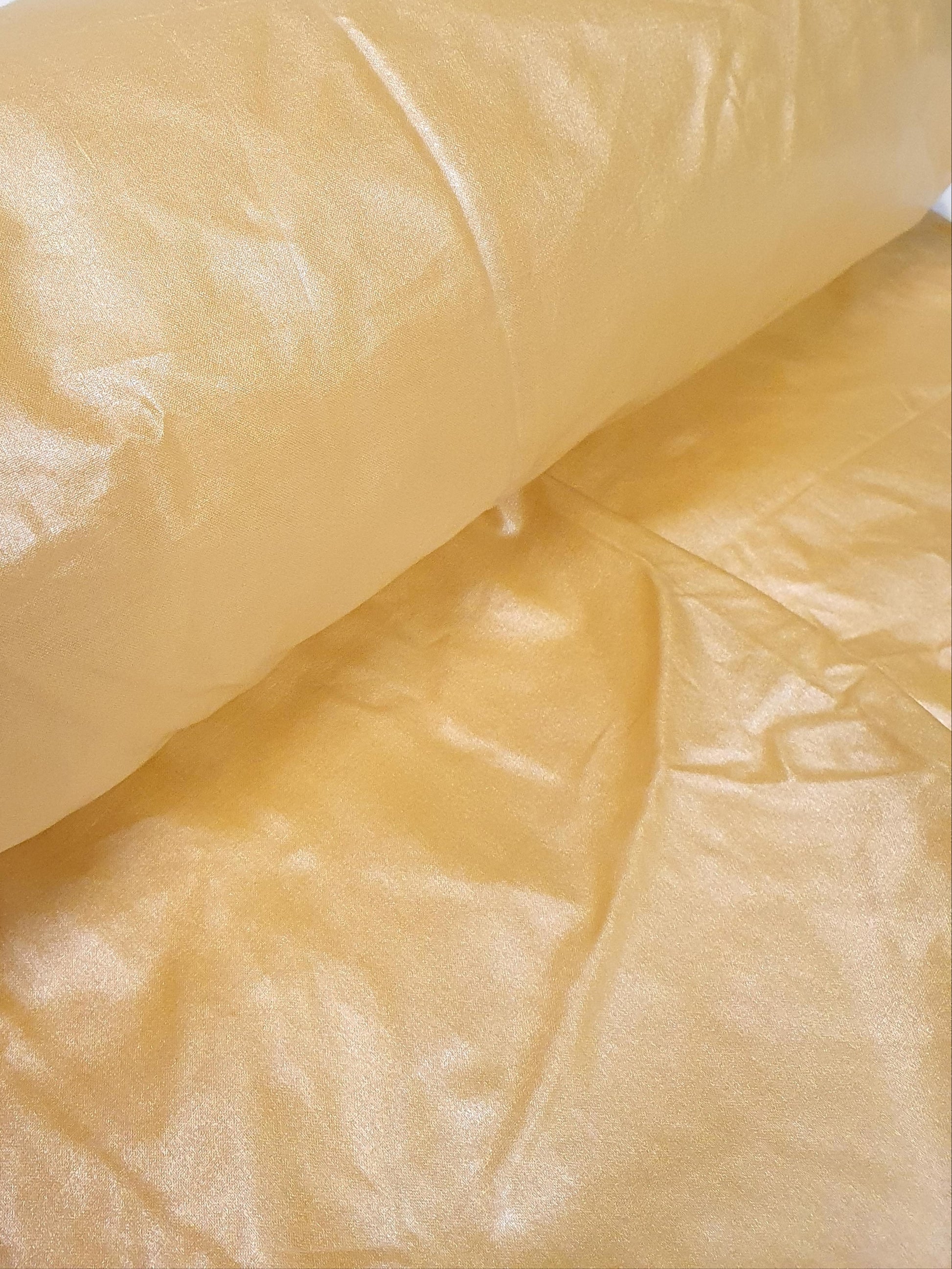 Close-up of water repellent coating light-weight fabric in yellow