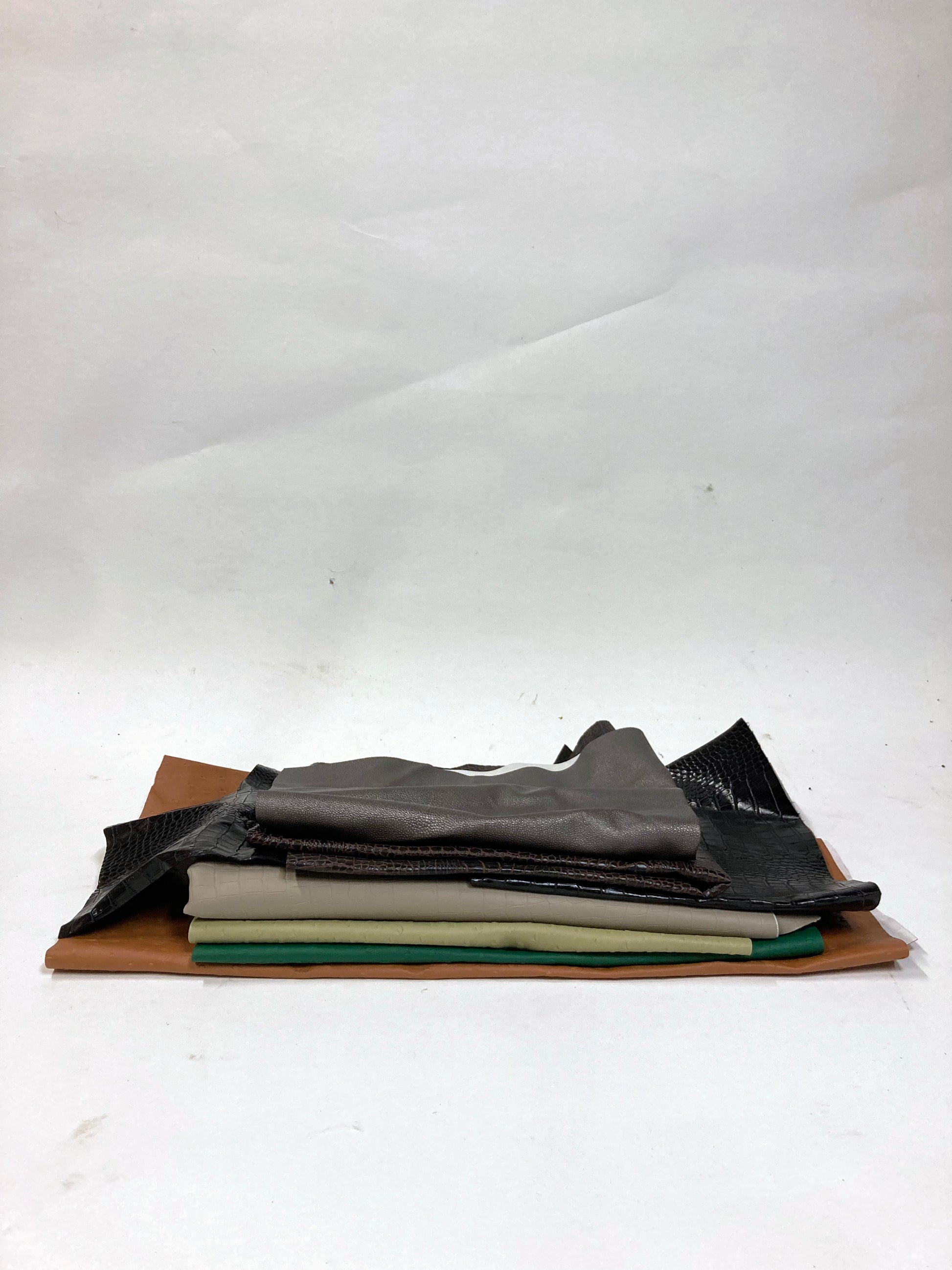 Stack of faux leather with various colours 
