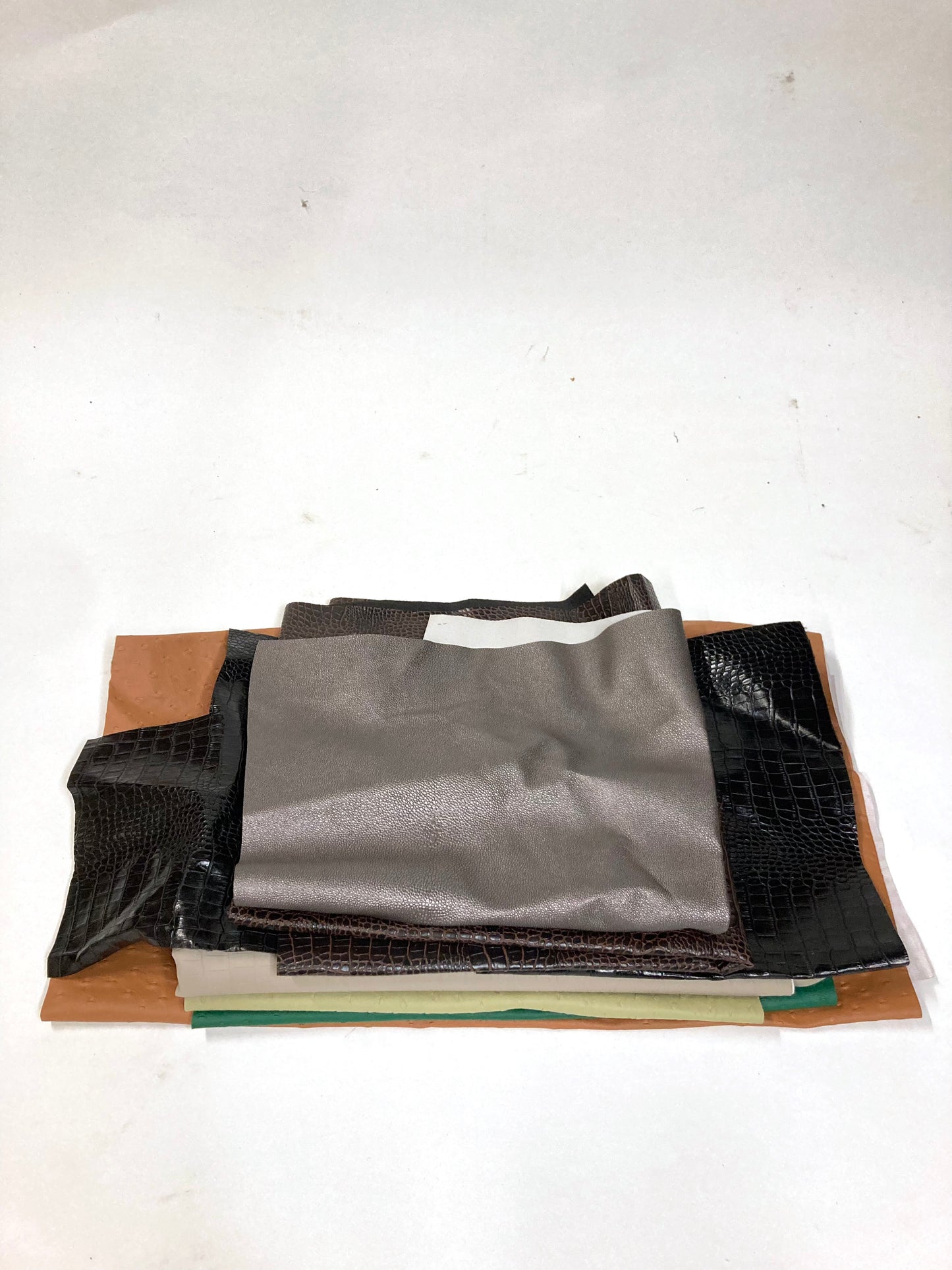 Stack of faux leather with various colours 