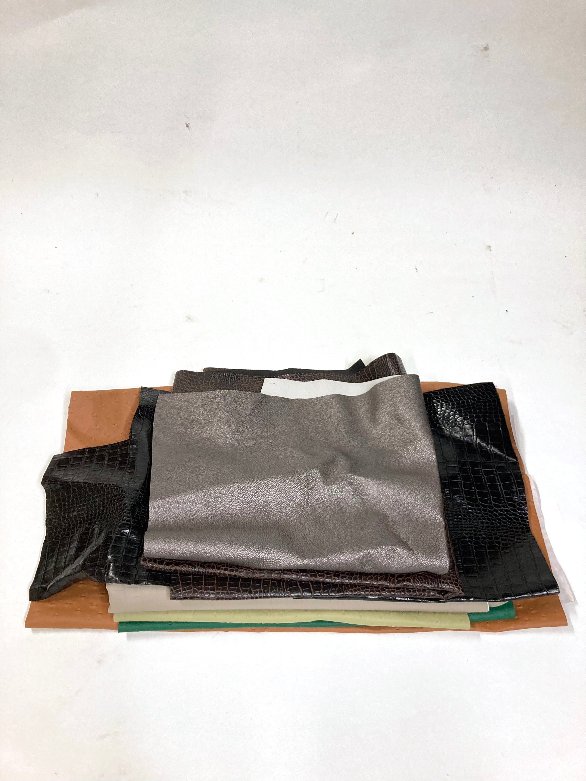Stack of faux leather with various colours 